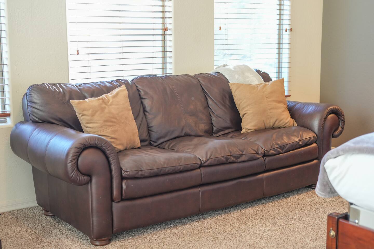 Comfortable sofa seating inside the primary bedroom for added relaxation