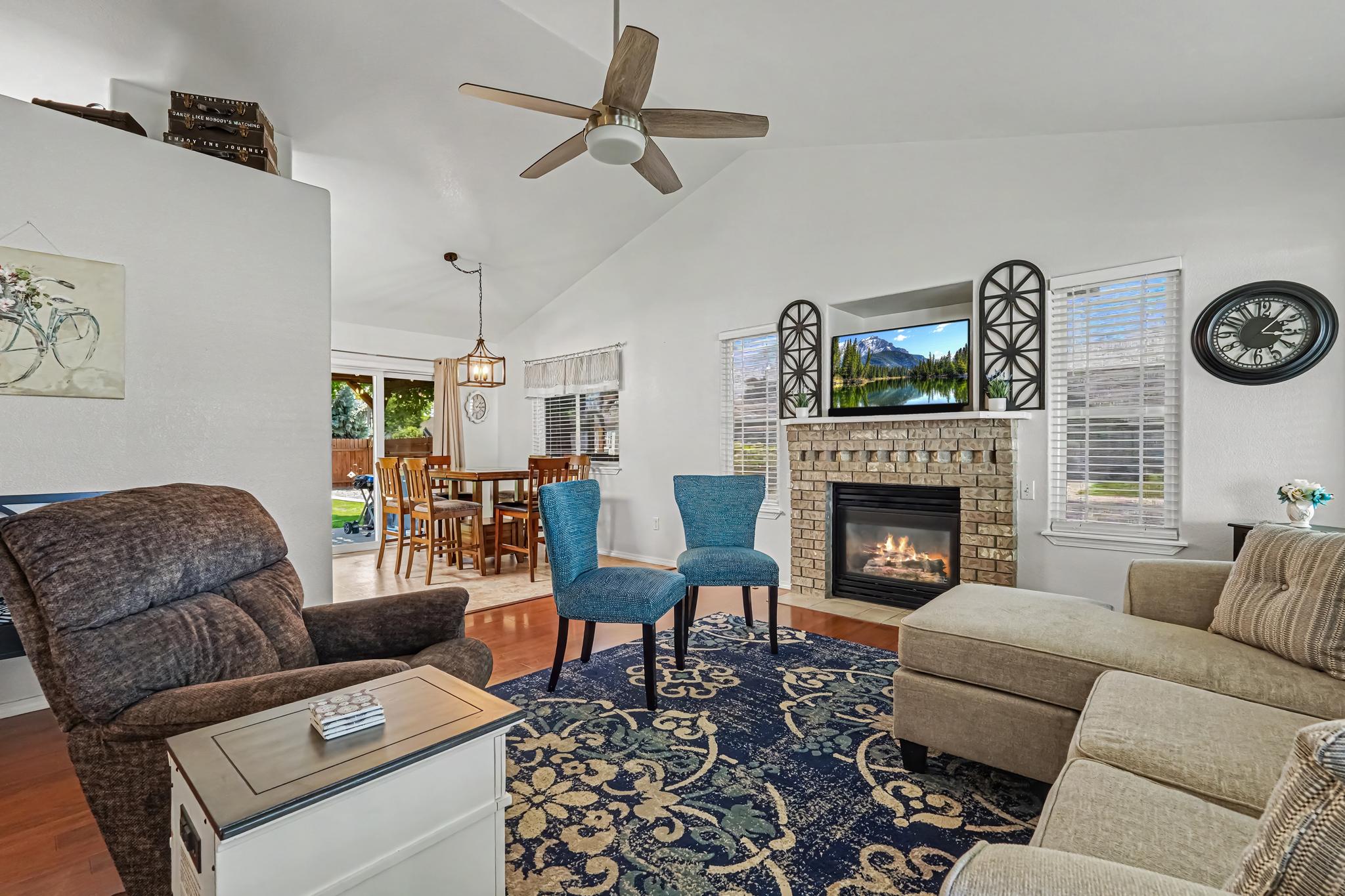 The living room flows seamlessly into the kitchen and opens directly to the backyard, creating the perfect space for gathering, entertaining, and making lasting memories with family and friends.