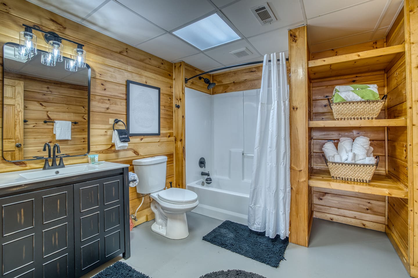 Full bathroom in the basement with sink, toilet and tub - right off the game room!