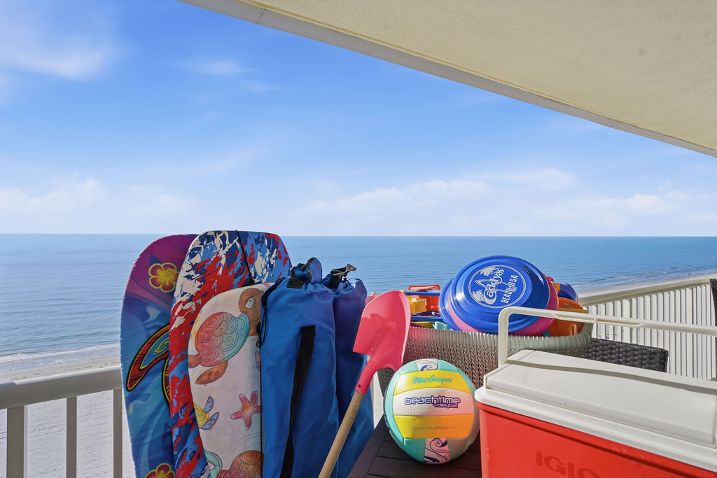 Private beachfront balcony stocked with beach gear making it easy to enjoy the beach.