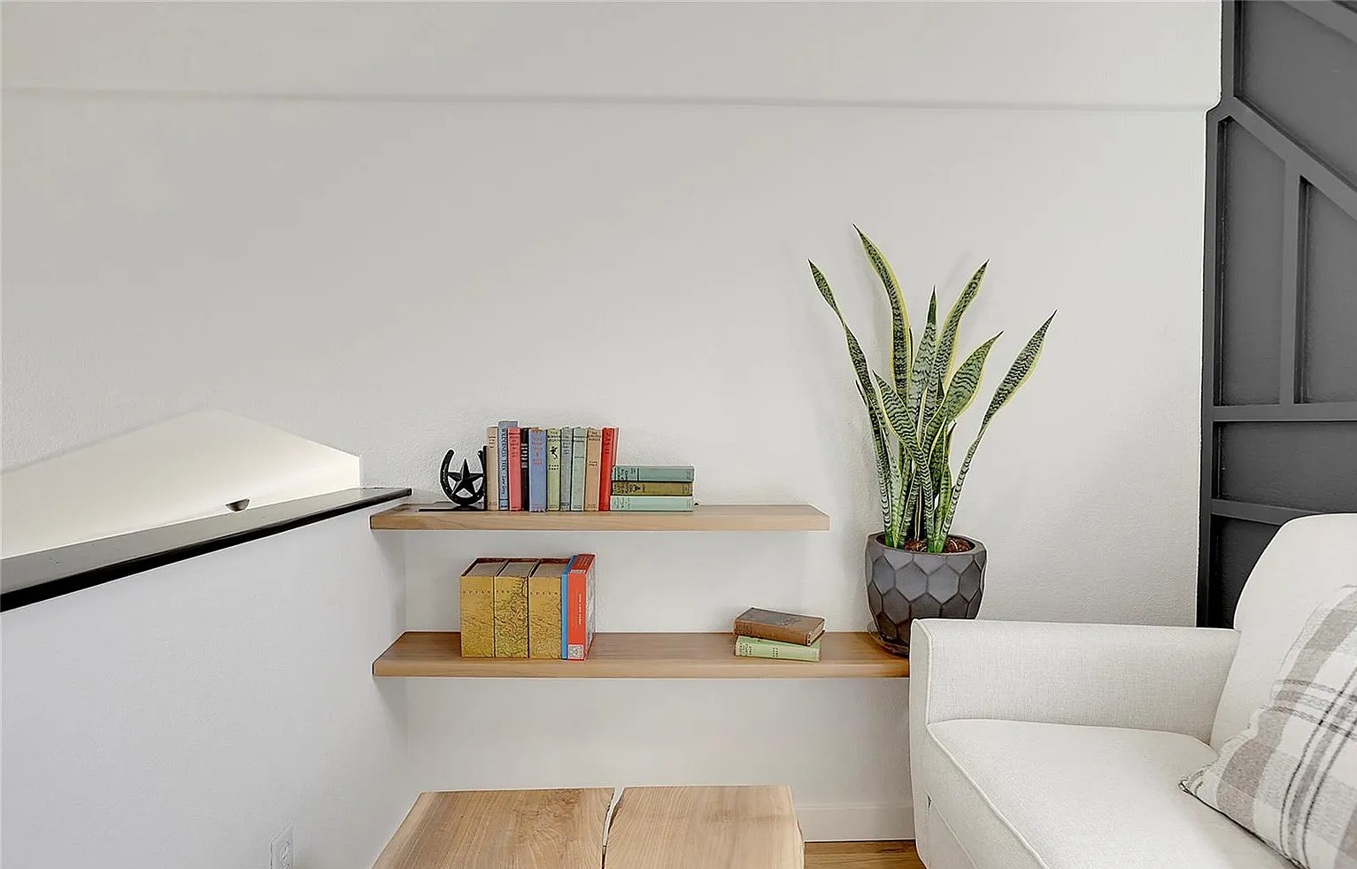 A quiet, sunlit corner dedicated to curling up with a good book or enjoying a peaceful moment.