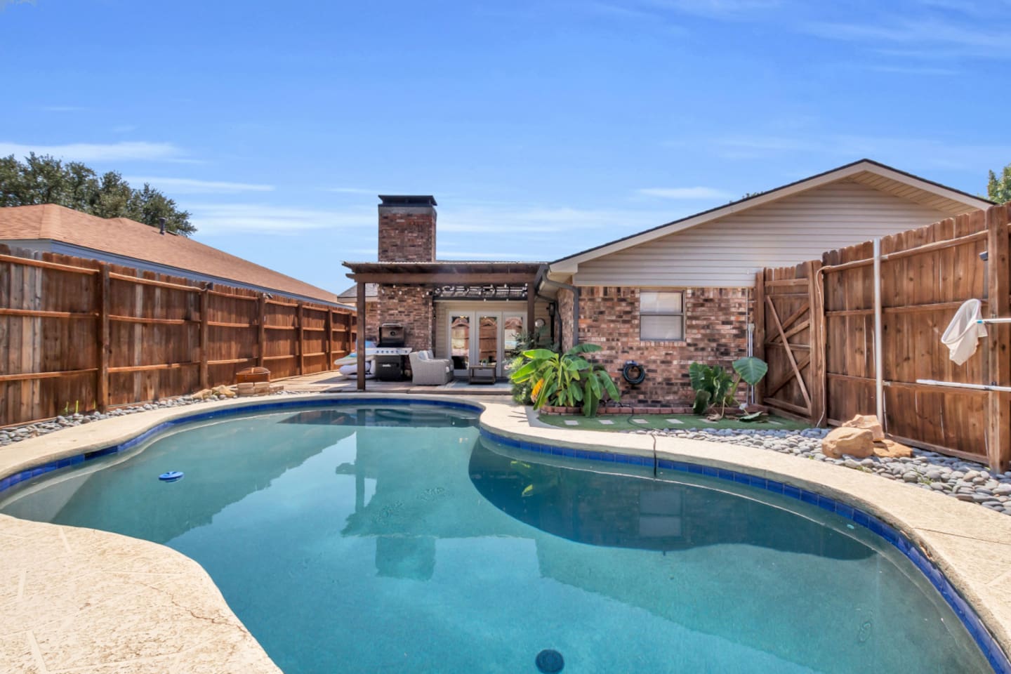 Backyard goals! This oversized pool is made for splashing, lounging, and long afternoons under the Texas sun