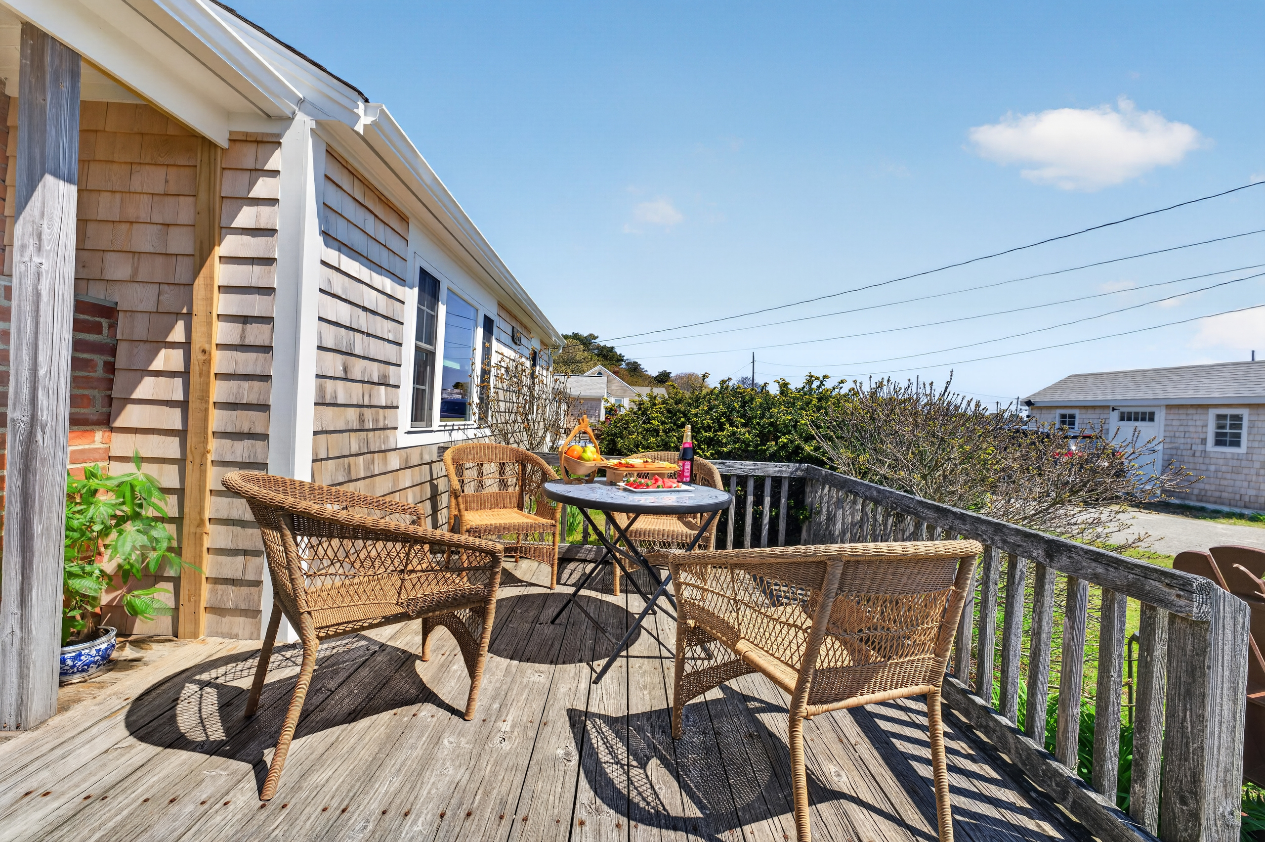 Sit back, relax, and enjoy the charm of a cozy front porch setting.