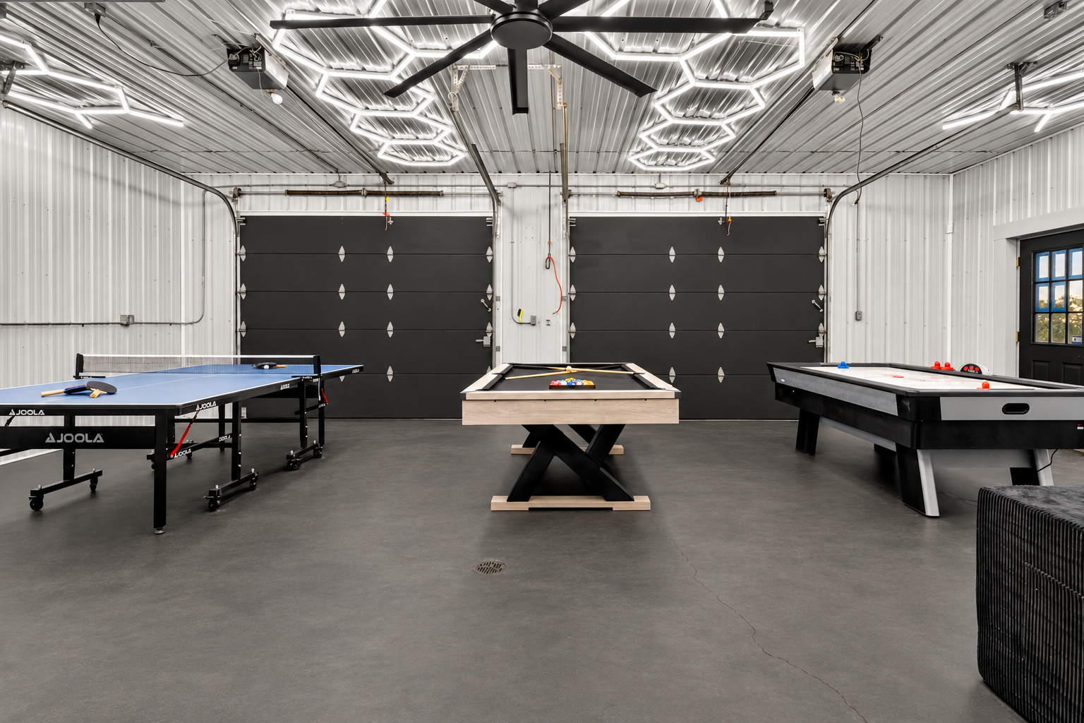 Spacious recreation room with multiple game tables