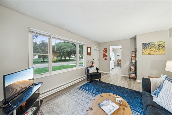 The living room overlooks the charming Stillwater neighborhood.
