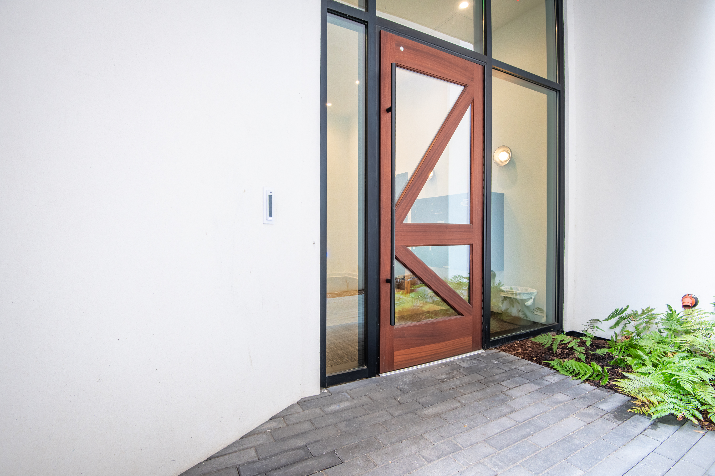 Contemporary glass entryway offering a stylish welcome