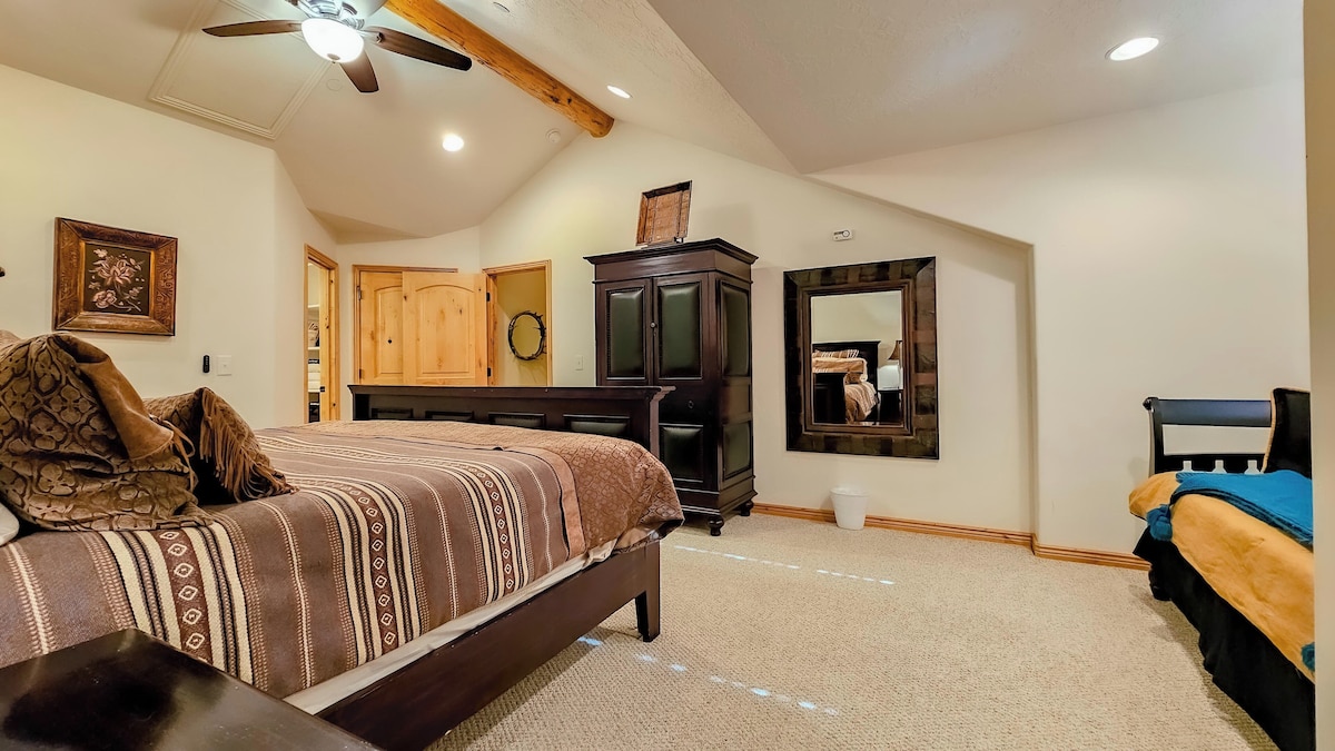 The primary bedroom suite boasts a luxurious king-sized bed, an ensuite bathroom and ample storage space.