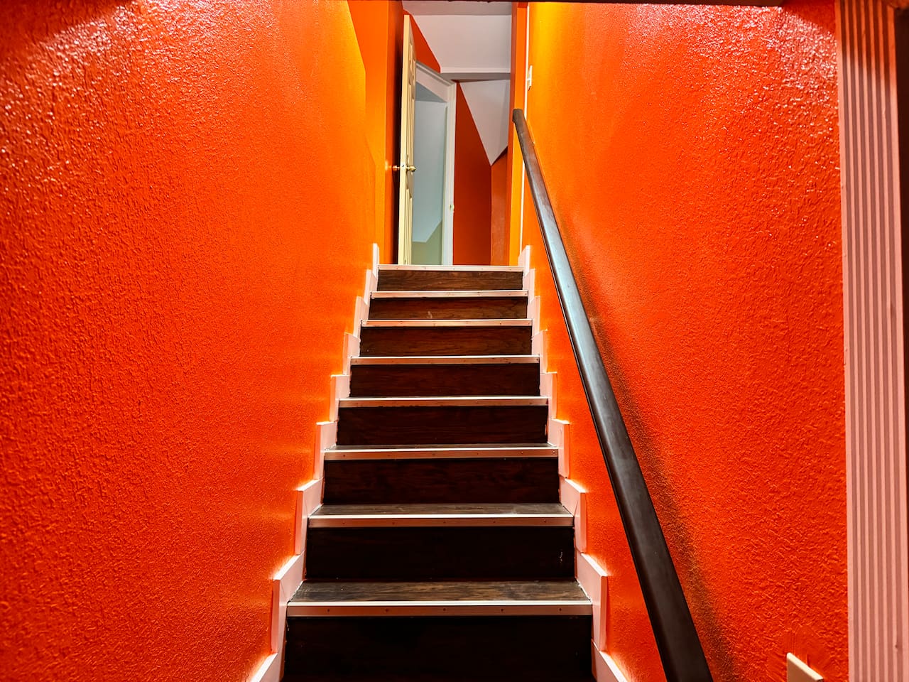 Stairs leading up to 3 extra bedrooms