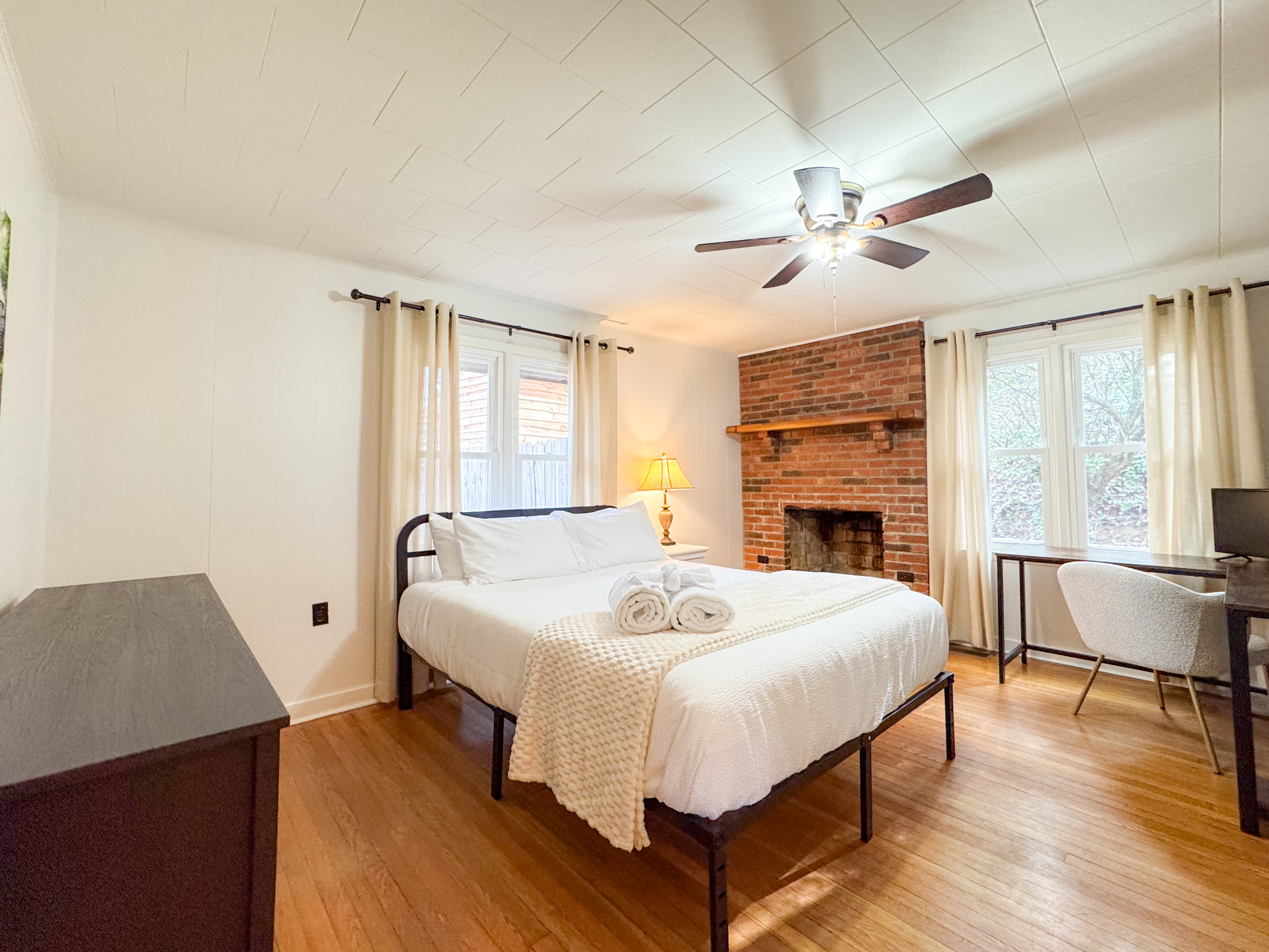 Our second guest bedroom features a queen size bed with comfy, high thread count linens and shredded bamboo pillows! The beds are cooling memory foam with a medium firm feel. Please note the fireplace is not a functional fireplace. 