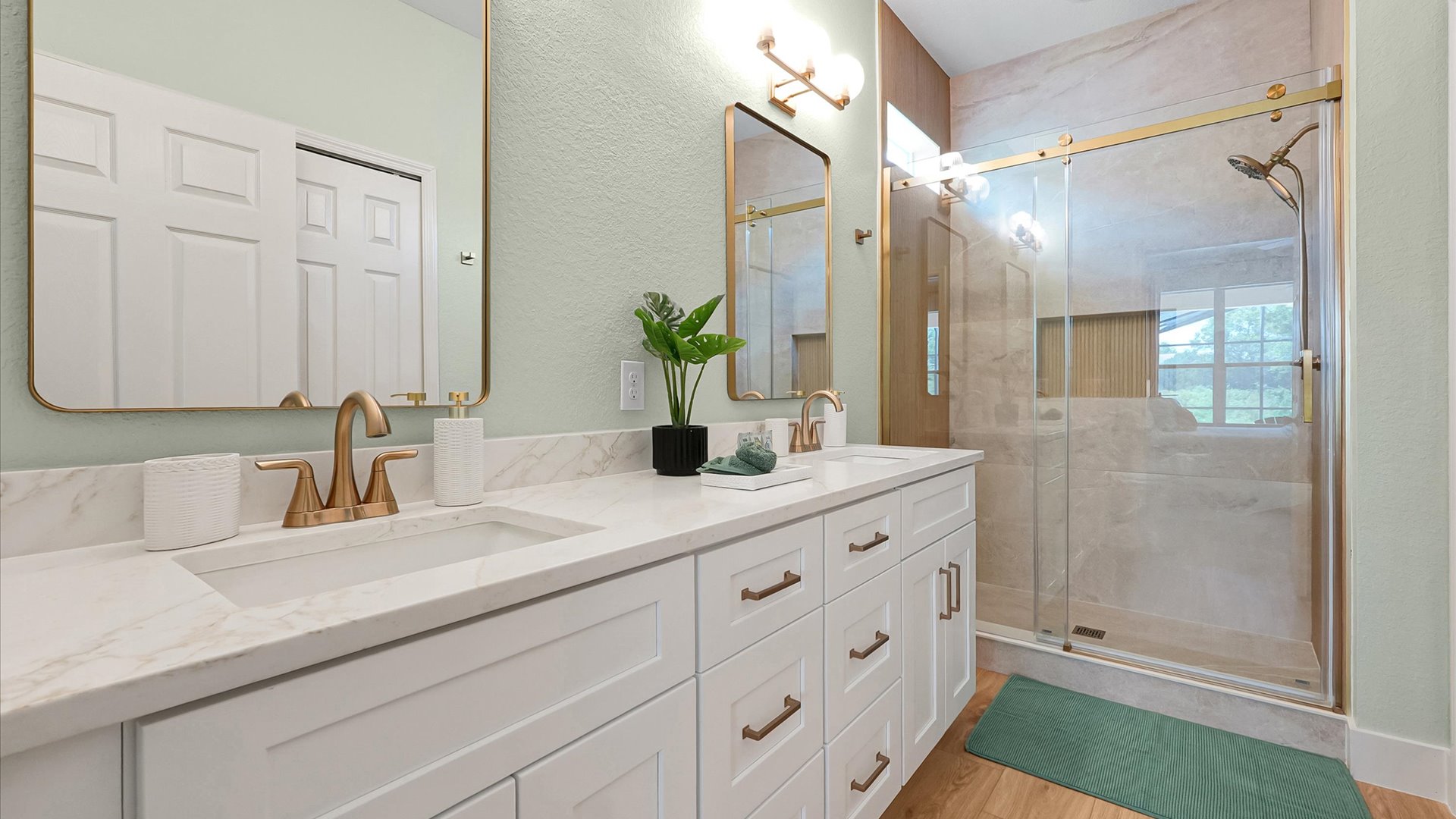 Moana King Suite Ensuite: Completely renovated ensuite with a double vanity, custom-tiled walk-in shower and champagne-bronze finishes.