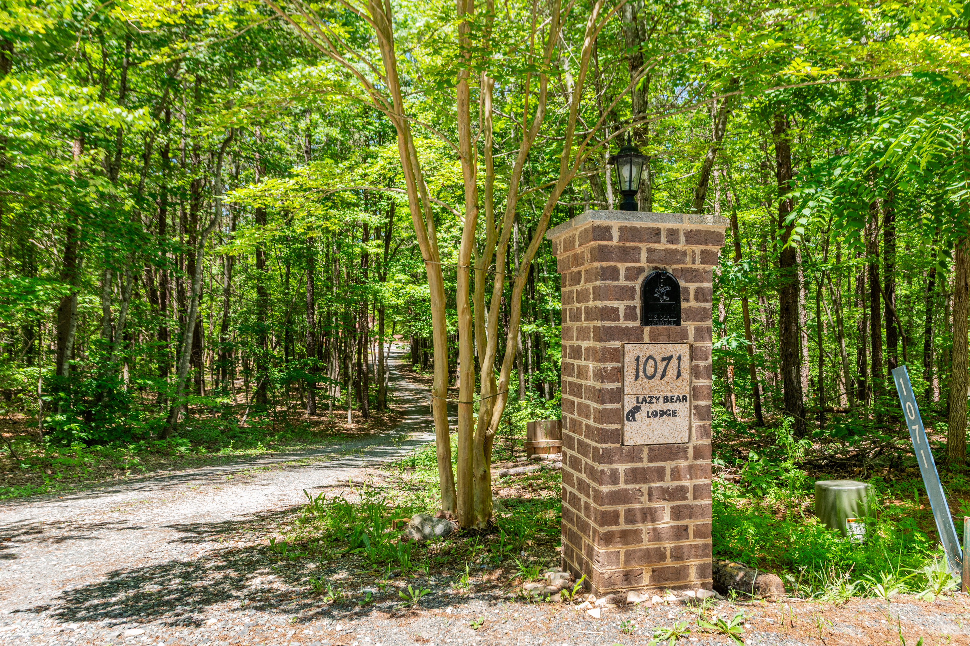 Entrance to Serenity: Discover nature's embrace at Lazy Bear Lodge, your escape awaits!