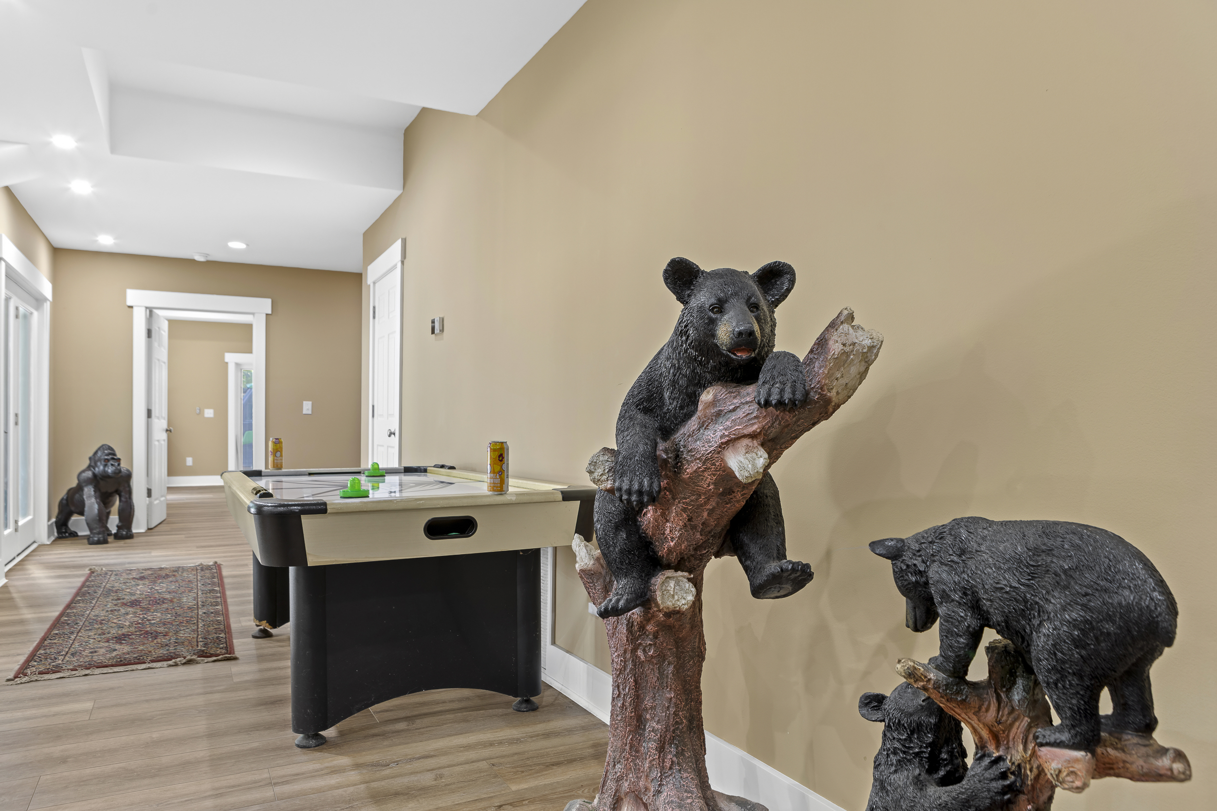 Game Room: Enjoy friendly competition with air hockey and whimsical bear decor!
