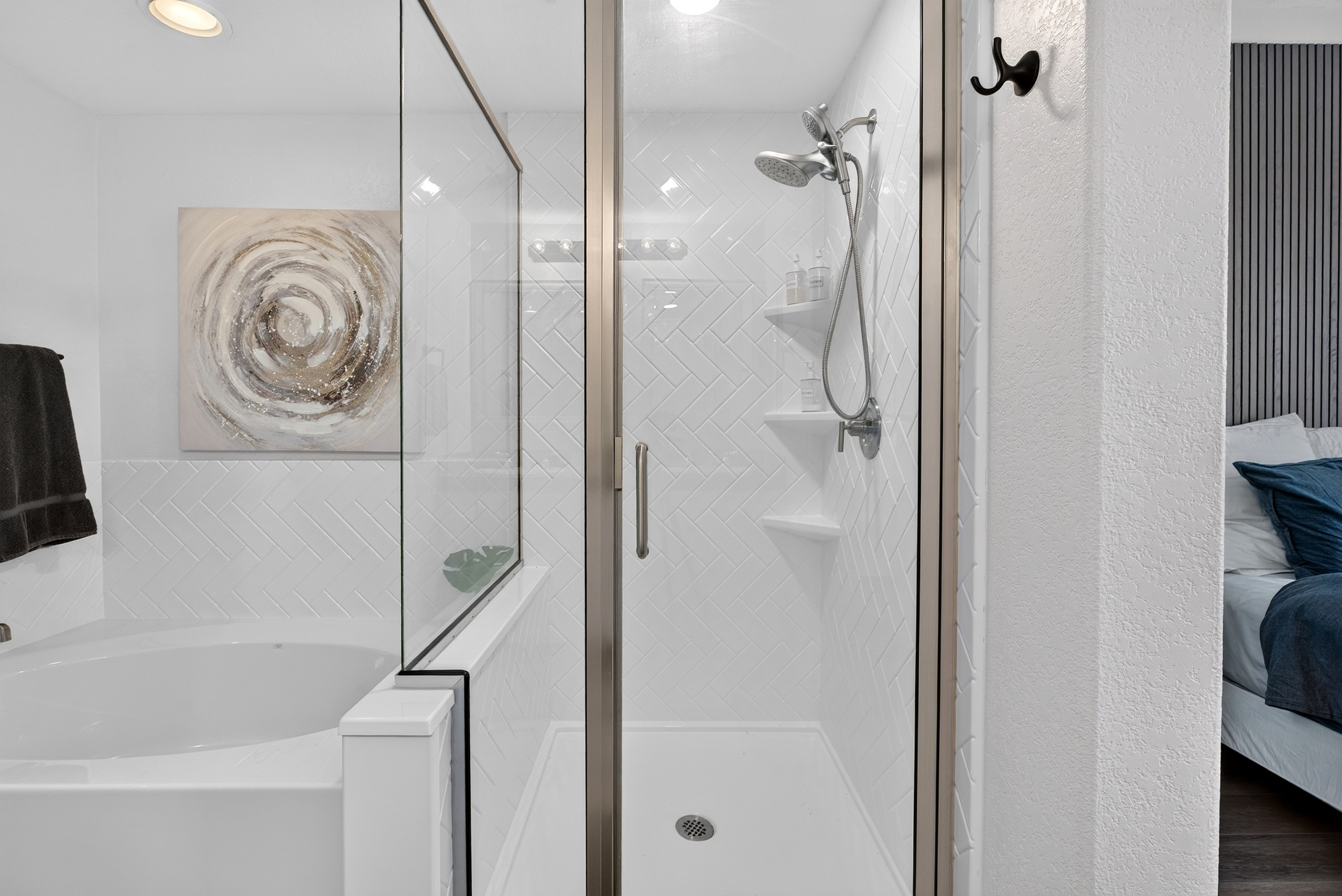 Bathroom with vanity storage, walk-in shower, soaking tub, and clean updated finishes for daily routines.