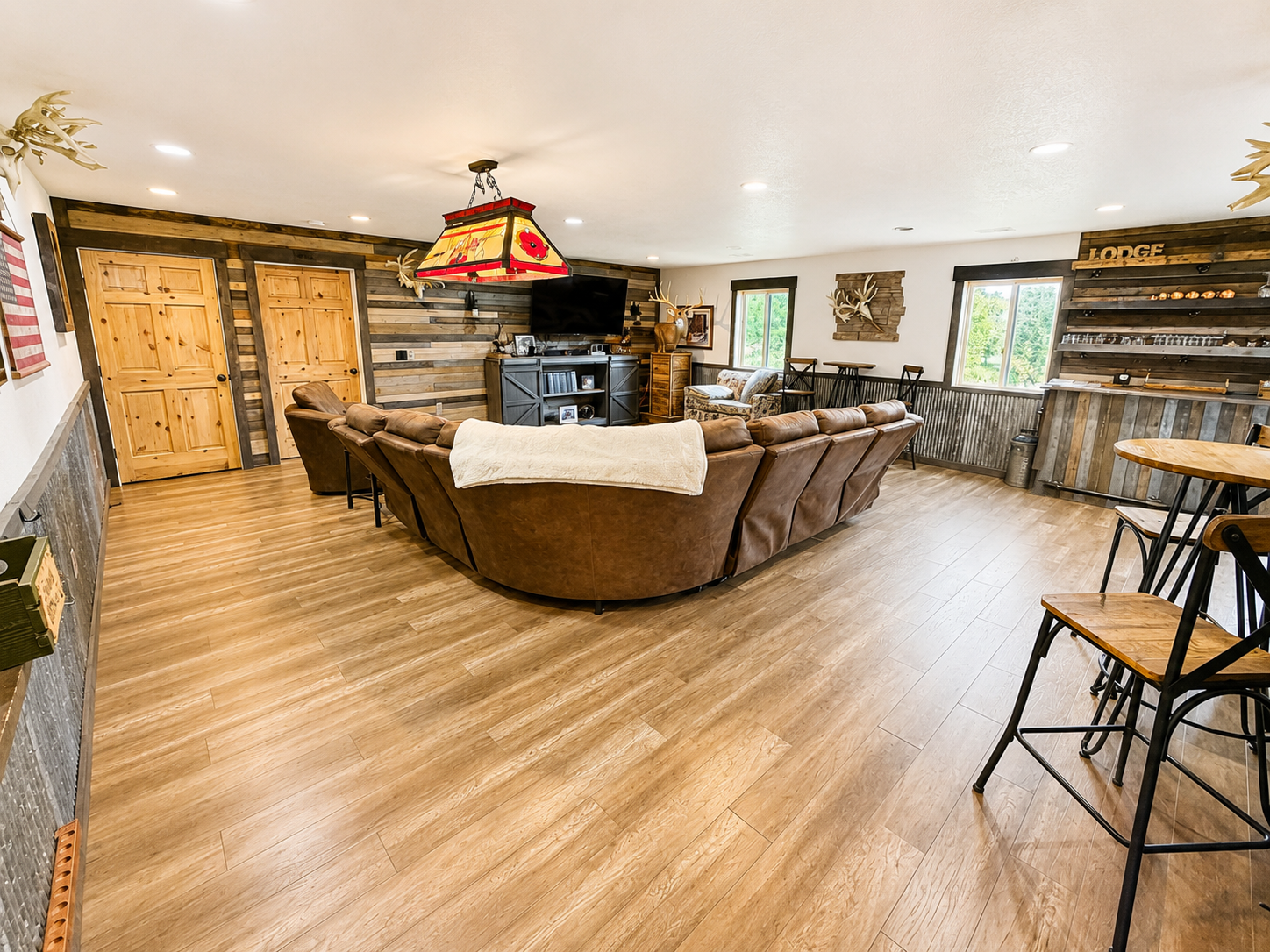 Spacious main gathering area with comfortable seating, rustic Northwoods character, and plenty of room for family and friends to relax together after a day of exploring Birchwood.