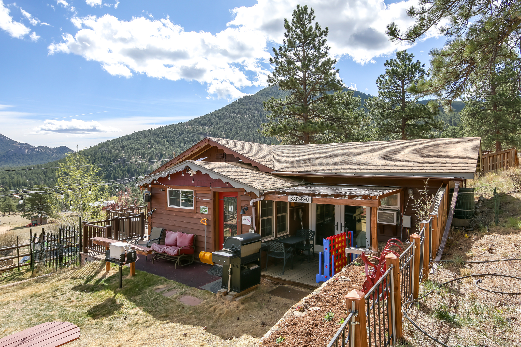 Grill and dine outdoors with views of the surrounding forest.