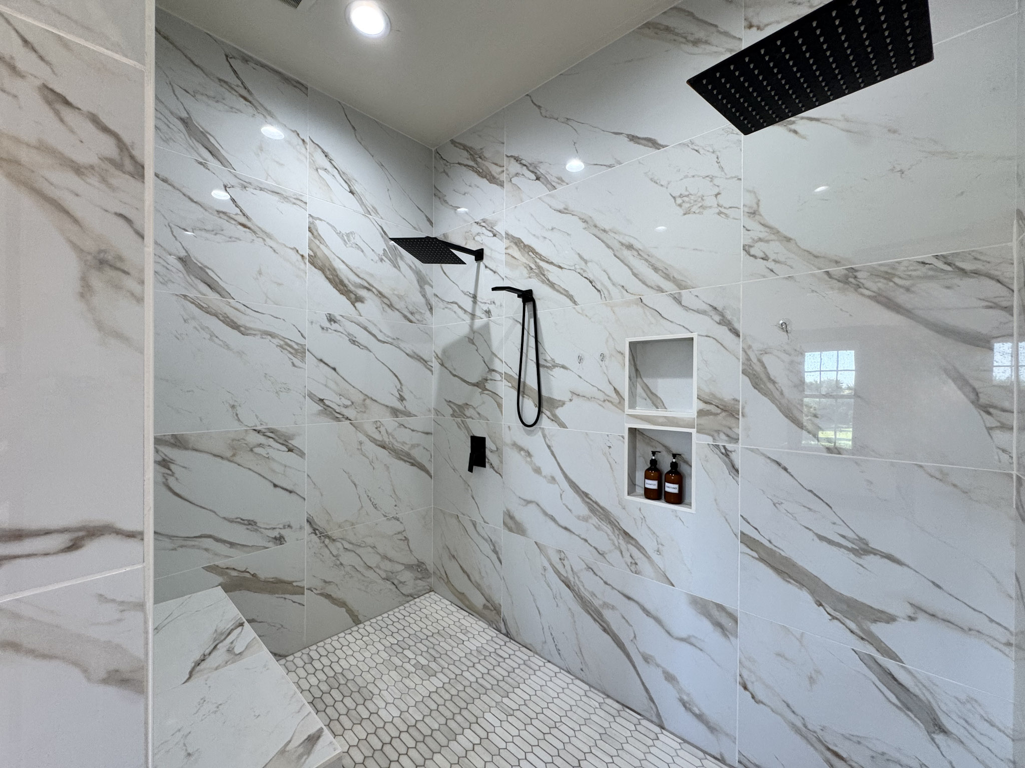 Main ensuite walk-in shower with dual shower heads. 