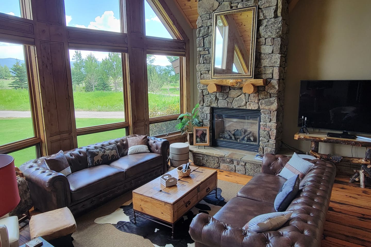 The view of the Tetons is spectacular from the living room!  Curl up with a book and blanket, or sip your coffee while watching the sunrise!  