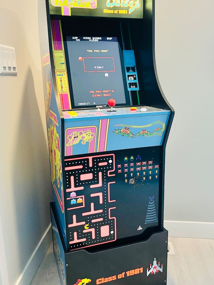 Unlock nostalgia with this life sized arcade system. Enjoy games like Ms. Pac Man, Galaga and more! 