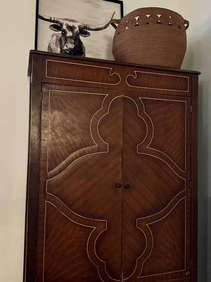 Beautiful antique wardrobe serves as your drawers and closet.  