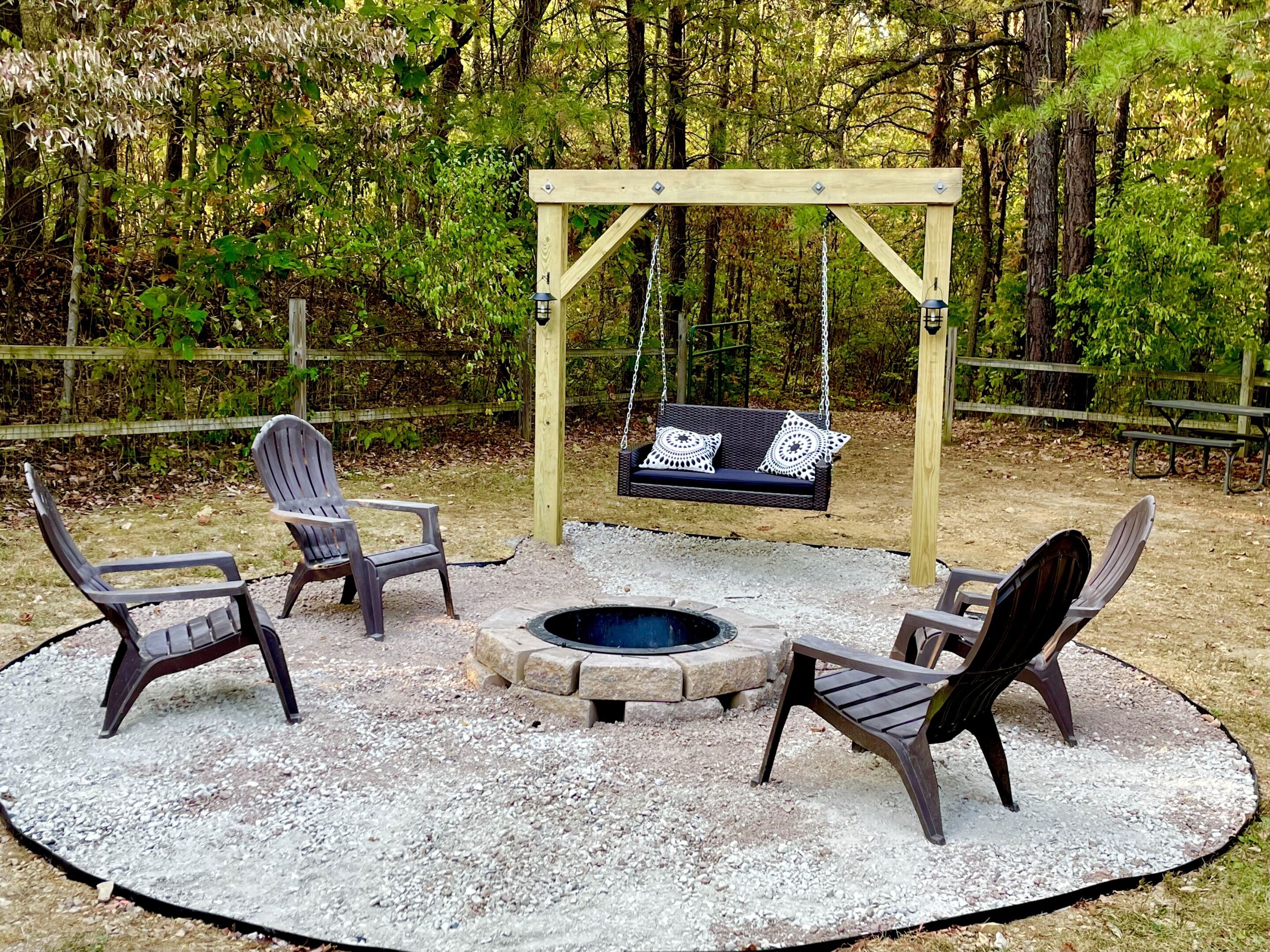 Fenced-in backyard with New Fire Pit Pergola Swing