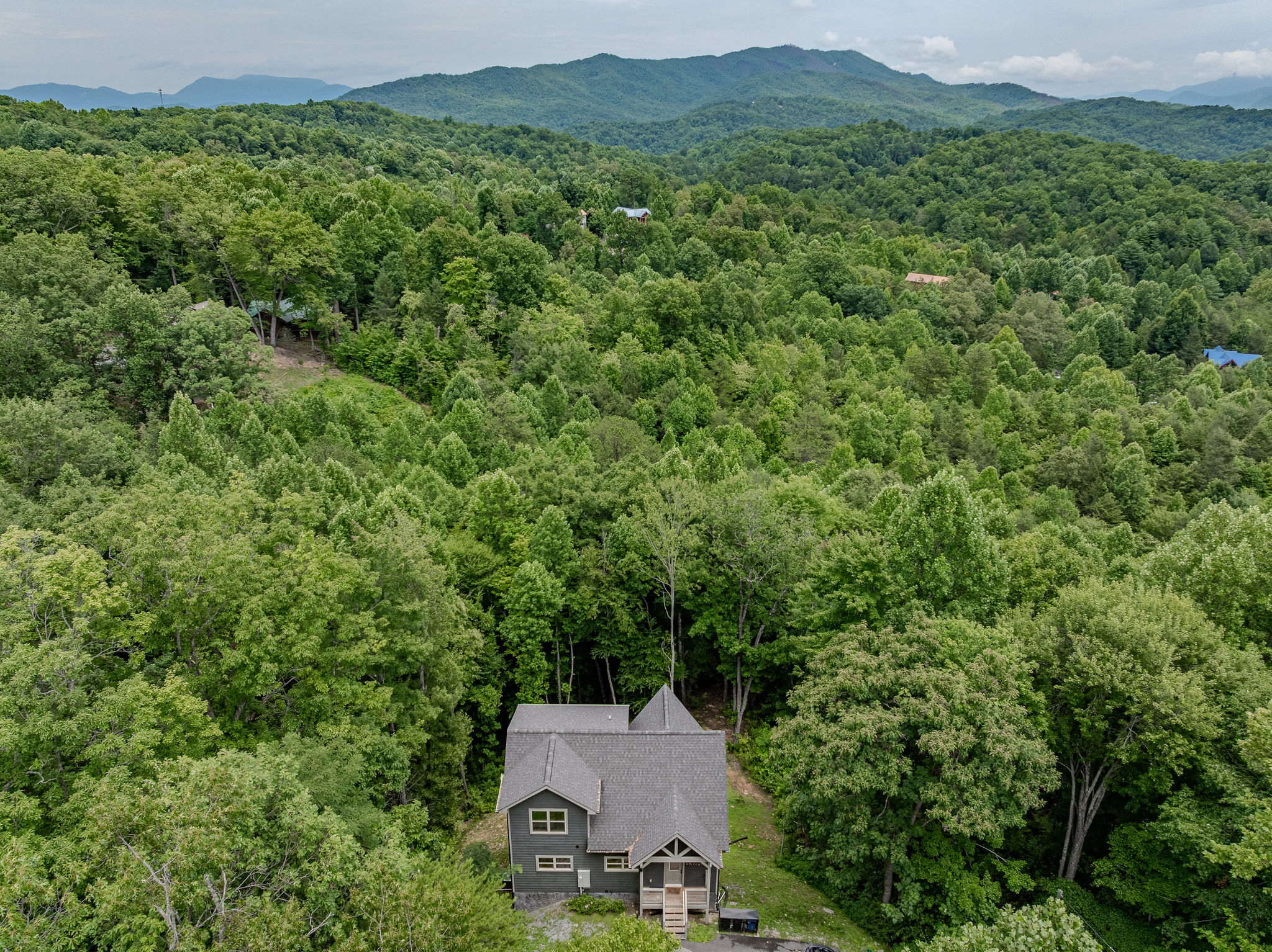 Welcome to Blue Smoke Outpost, tucked among the trees with the Smokies in the distance.