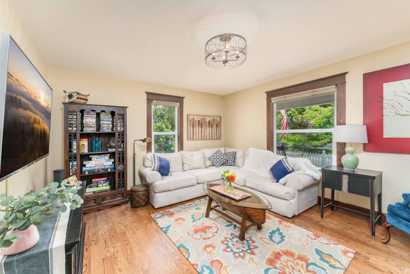 Living room features a brand-new TCL 65” Mini-LED Smart TV (streaming) + complimentary DVDs.