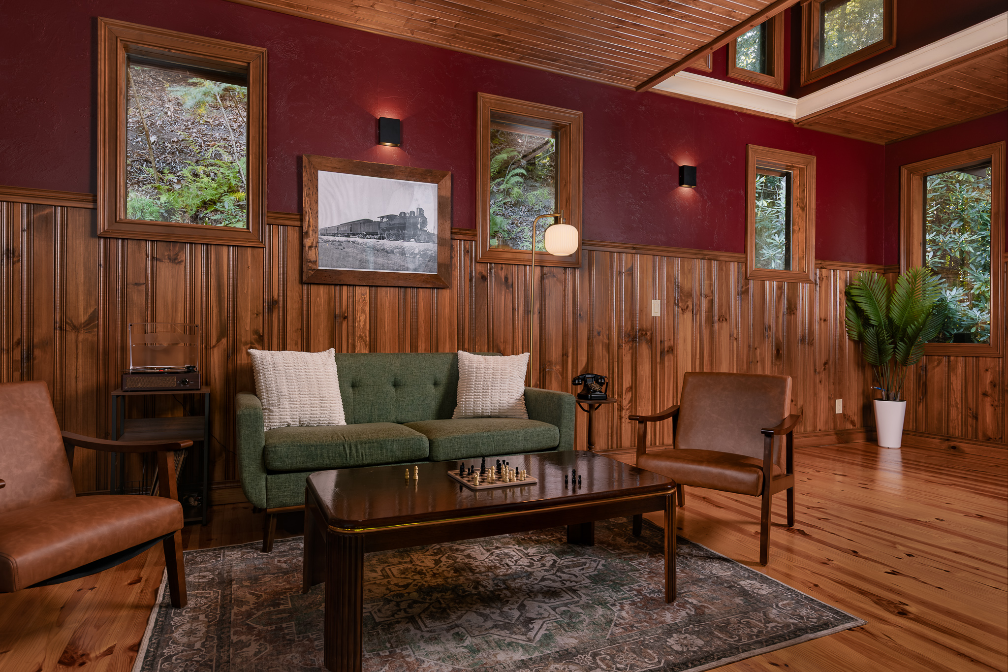 {Lookout Lounge Caboose} Step inside the hidden caboose for a cozy second lounge tucked into the woods—perfect for a quiet drink, conversation, or a little escape from the main house.
