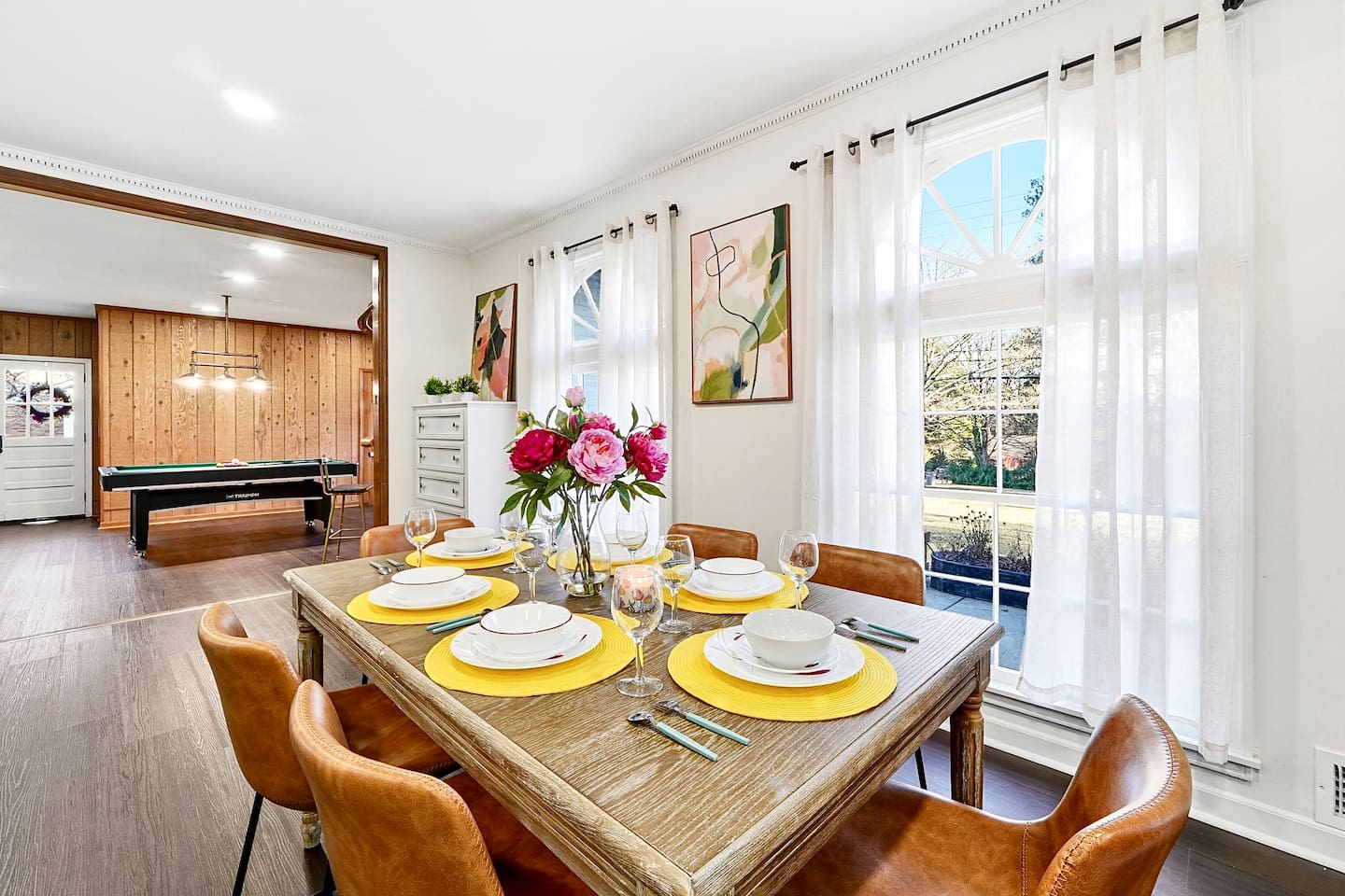 Charming wooden dining area comfortably seating up to 6 guests. Perfect for sharing meals, laughs, and creating lasting memories.