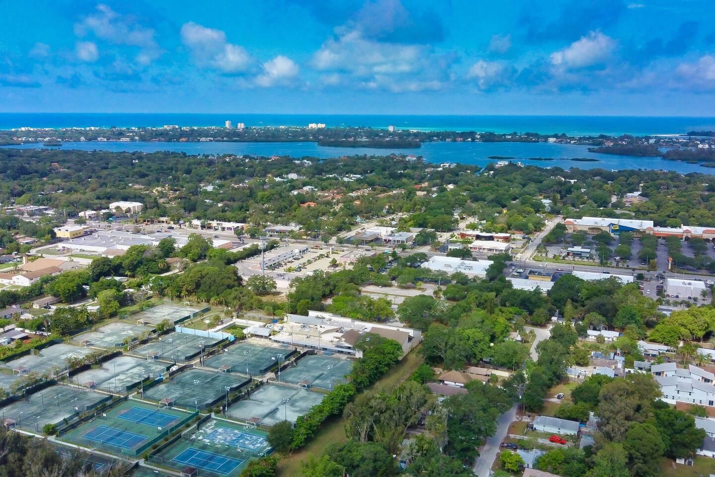 Westward aerial view above the home with views of Siesta Key.