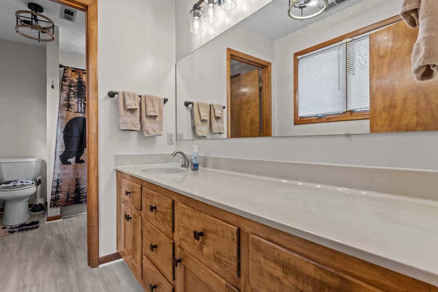 Bathroom Retreat: Refresh in style with modern fixtures and charming bear-themed decor!
