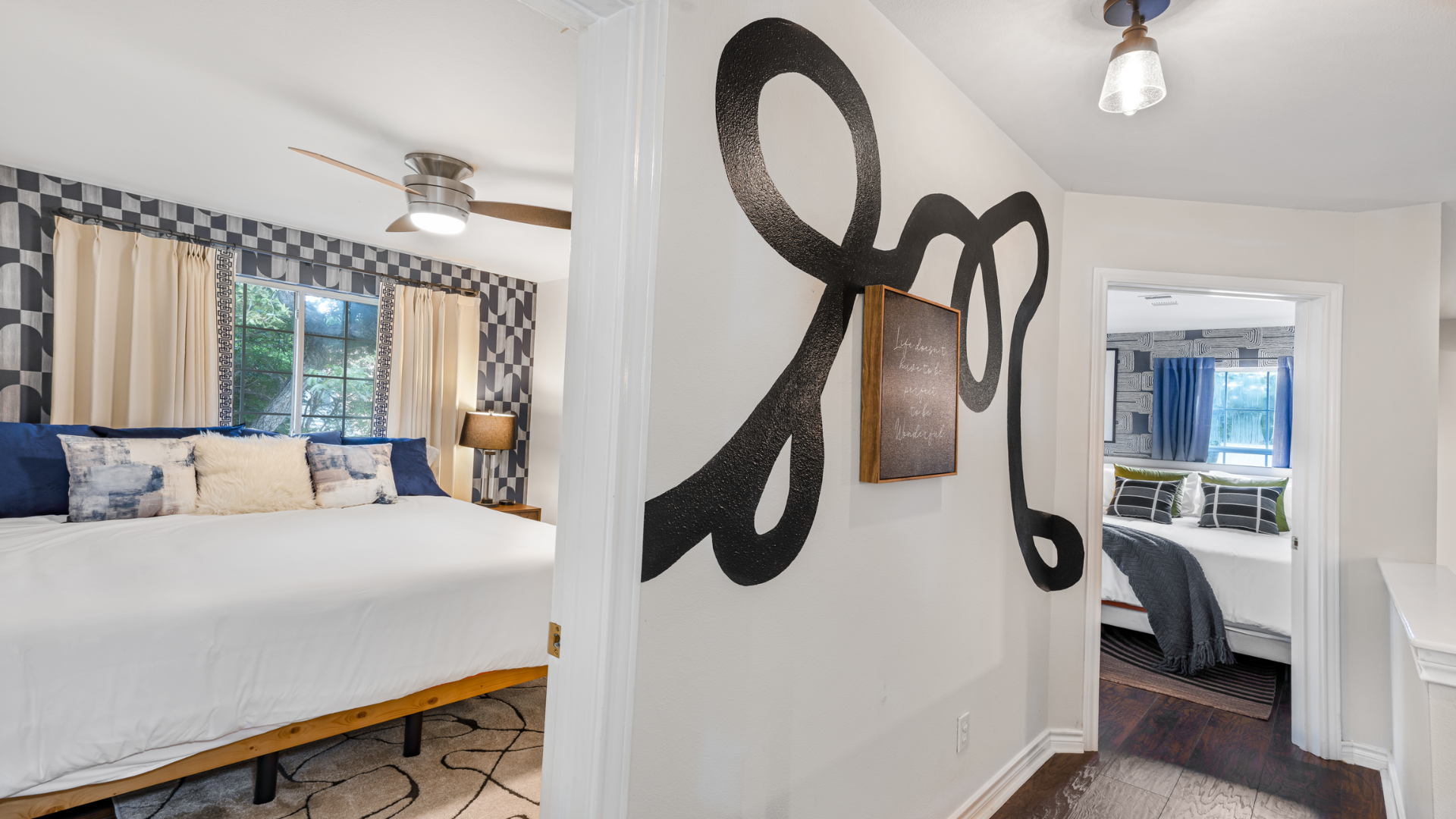 Explore the vibrant upstairs, where bold art and modern touches lead to stylish bedrooms. This space blends cozy vibes with elegance, offering a seamless transition to your personal retreat.