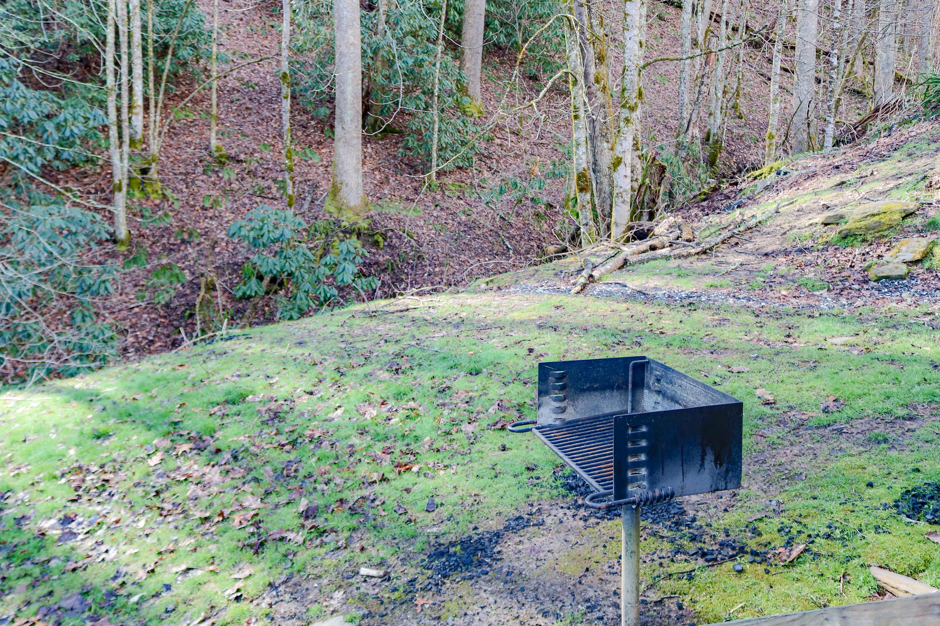 A large park style charcoal grill at the cabin
