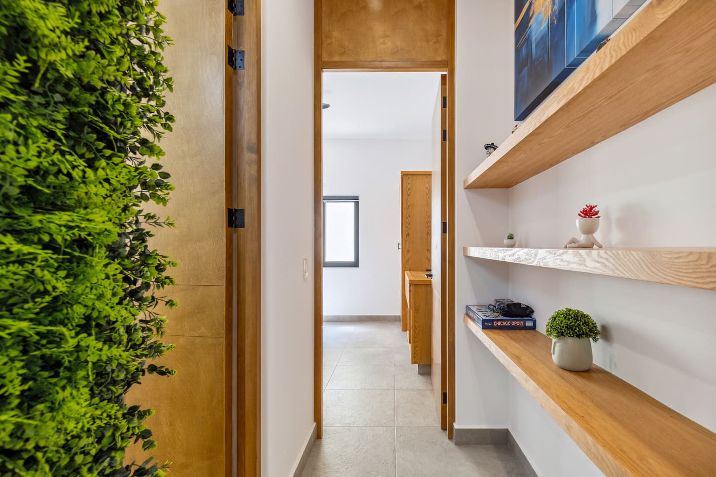 Nature wall hallway with board games, books and more.