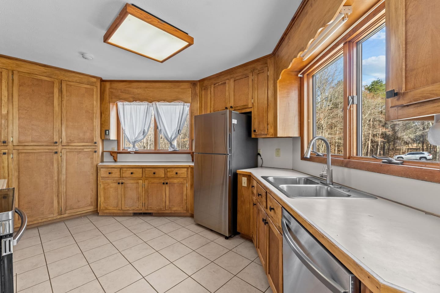 Kitchen: Bright and inviting space with stunning views and plenty of storage for culinary adventures!