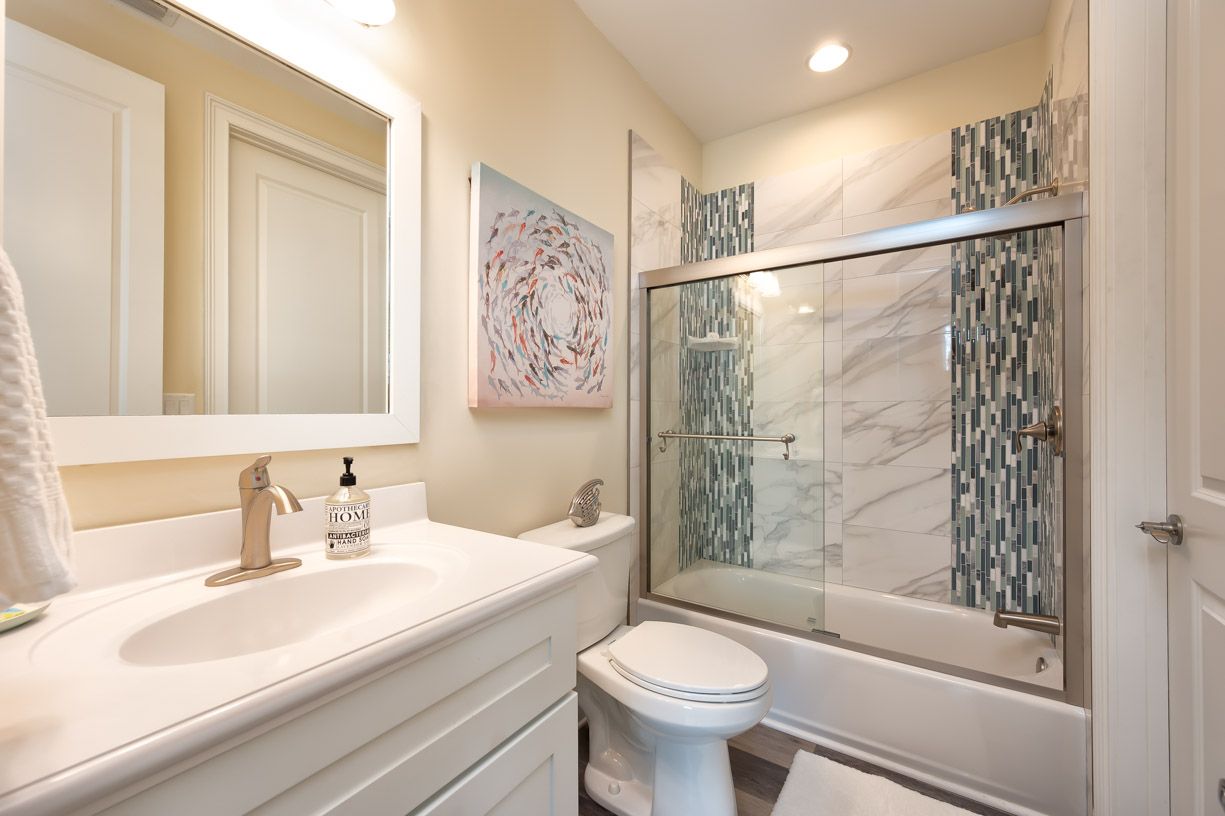 Guest Bath Downstairs, Opens to Kitchen and Bedroom
