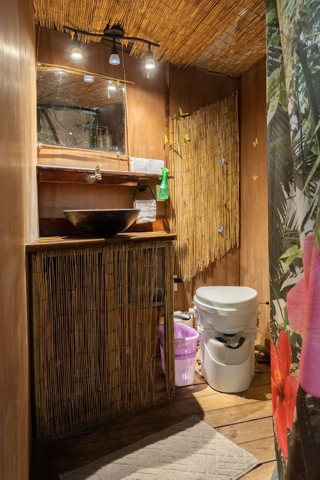 fully functional bathroom with running hot/cold water and compost toilet