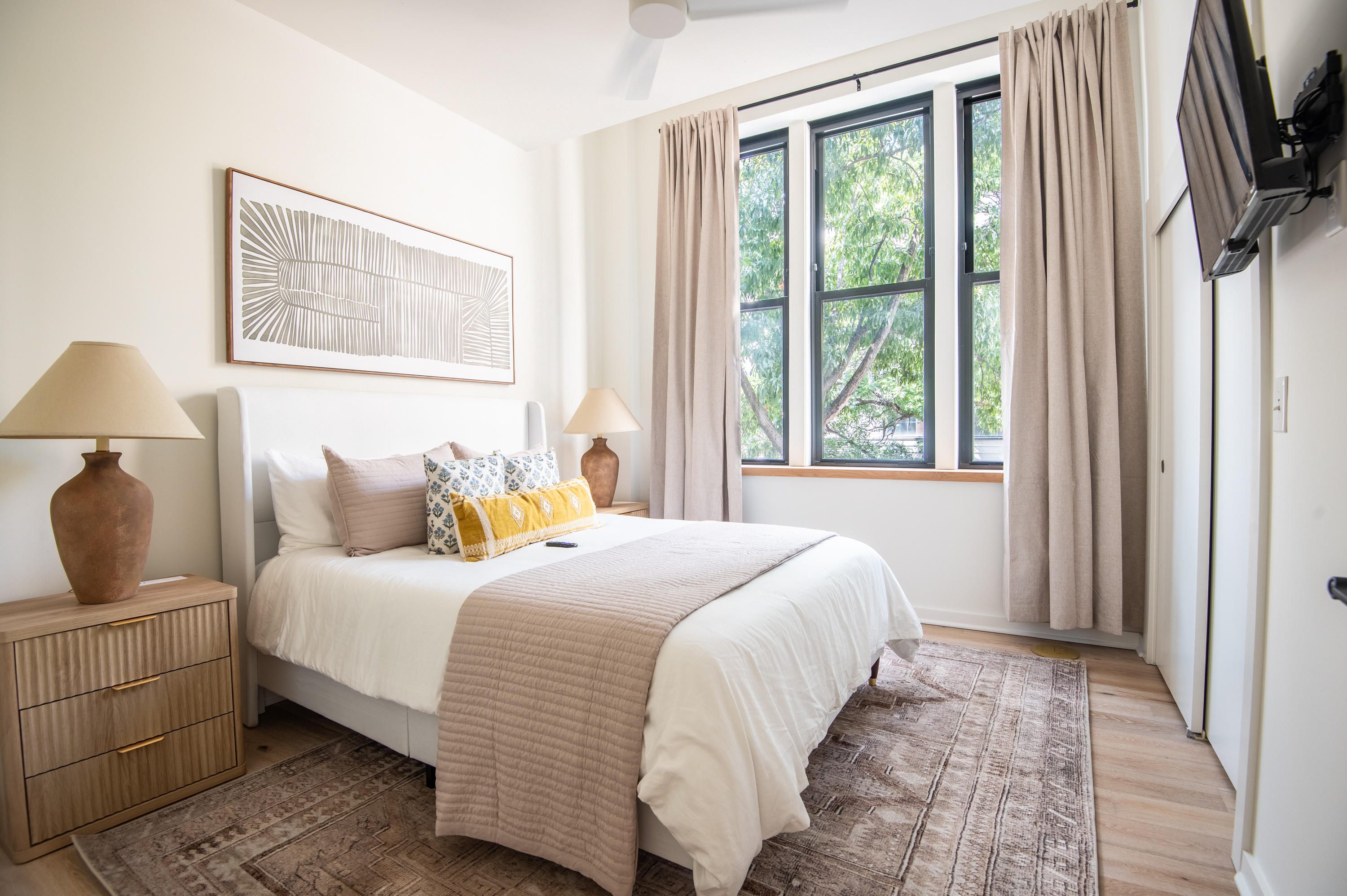 Peaceful bedroom retreat with natural light and cozy bedding