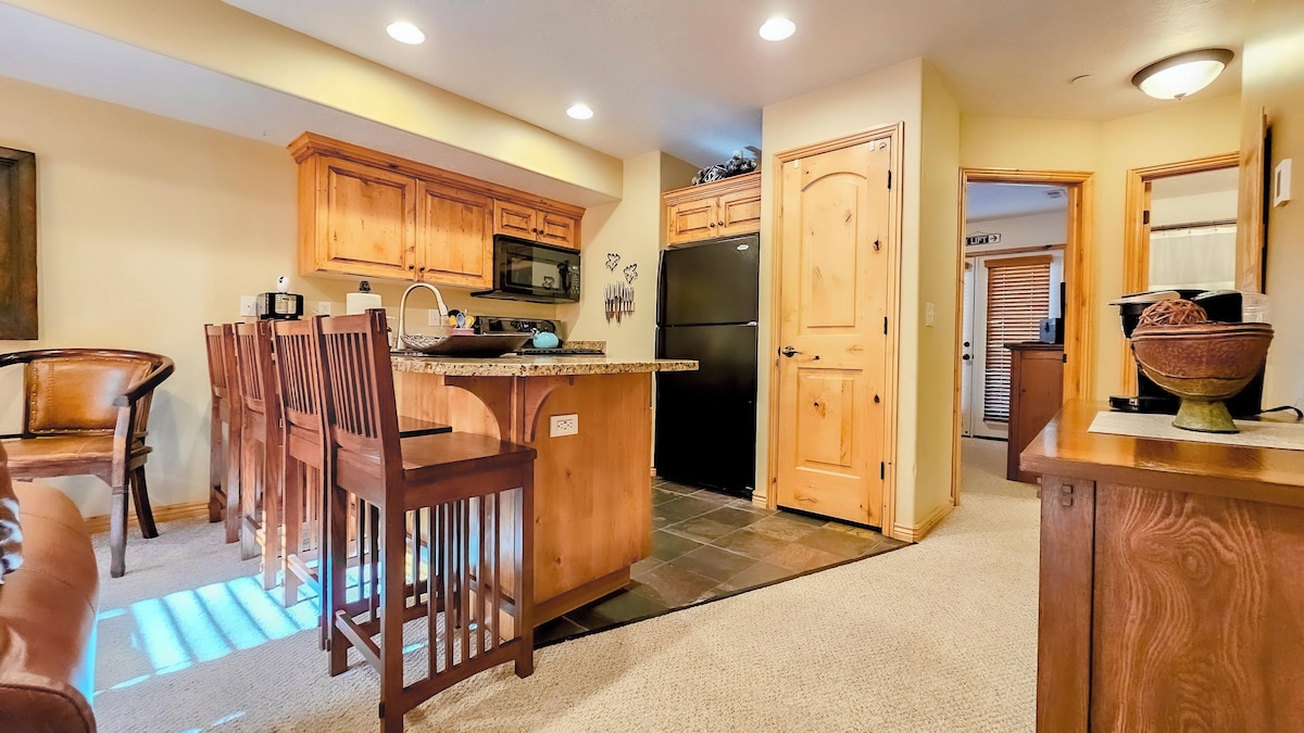 Indulge in culinary delights in the cozy kitchen, equipped with ample amenities for creating wonderful dinners with friends and family.