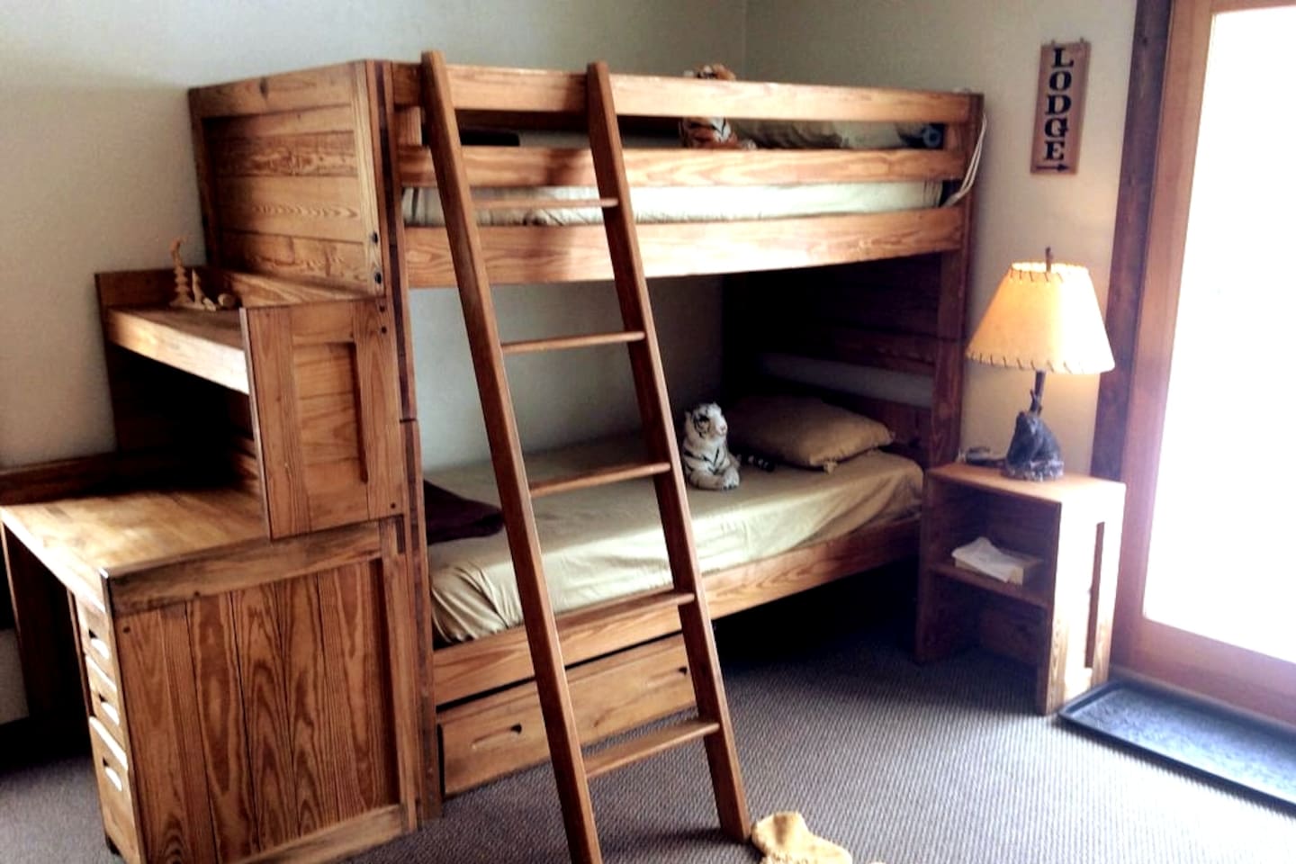 Bunk Bedroom, set up for kids with a stocked toy box, DVDs and VHS kids movies and a TV to play them on.