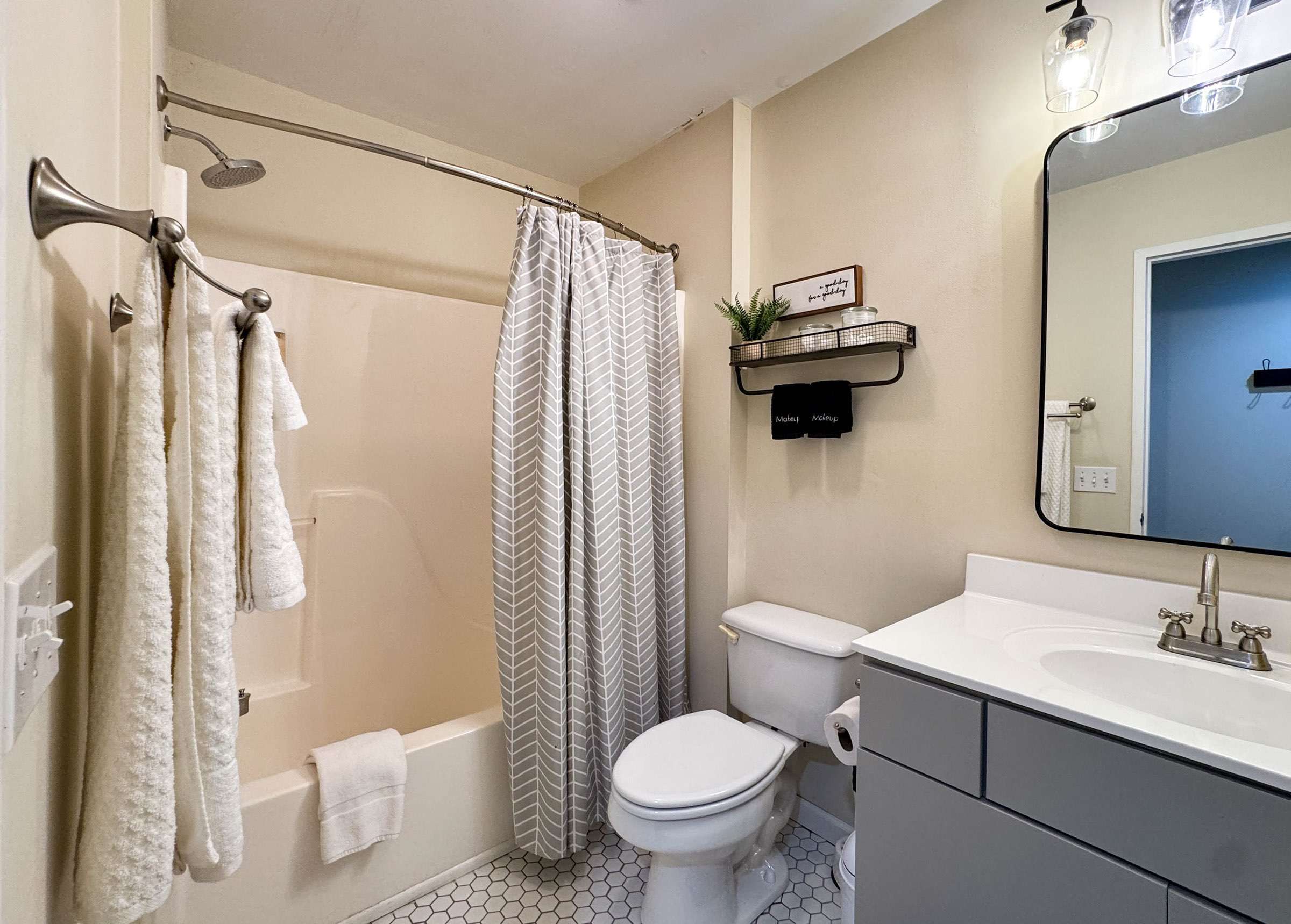 The main level bathroom features a combination tub/shower, toilet, and sink. One bath towel and wash cloth also provided for each guest.