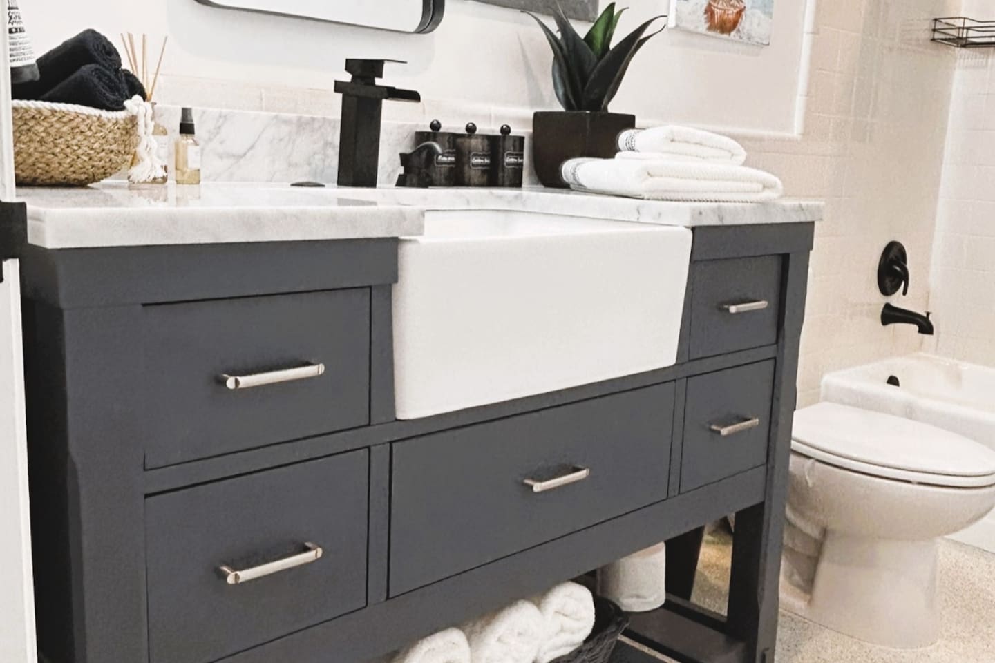 Bathroom, with large farm sink, and plenty of light. Creating a warm inviting space to shower, with plush oversized towels to wrap up in. We provide Bath Towels, Washcloths, Shampoo, Conditioner, Body Wash, Floss, Qtips, Cotton Balls, Toilet Paper