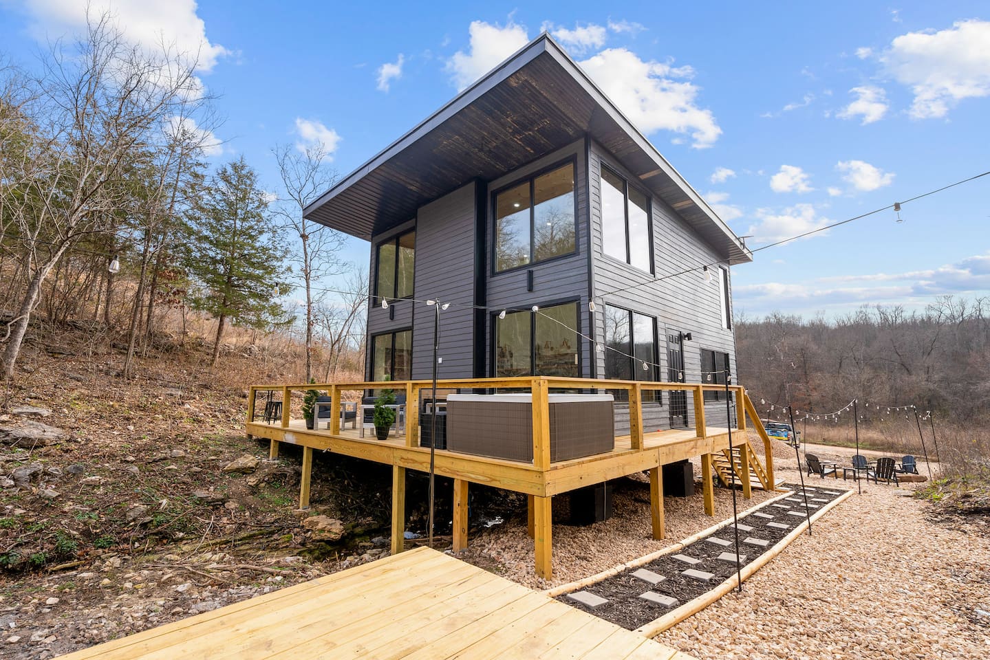 Outdoor Retreat: Embrace the surrounding nature on the spacious deck with views and hot tub delight!