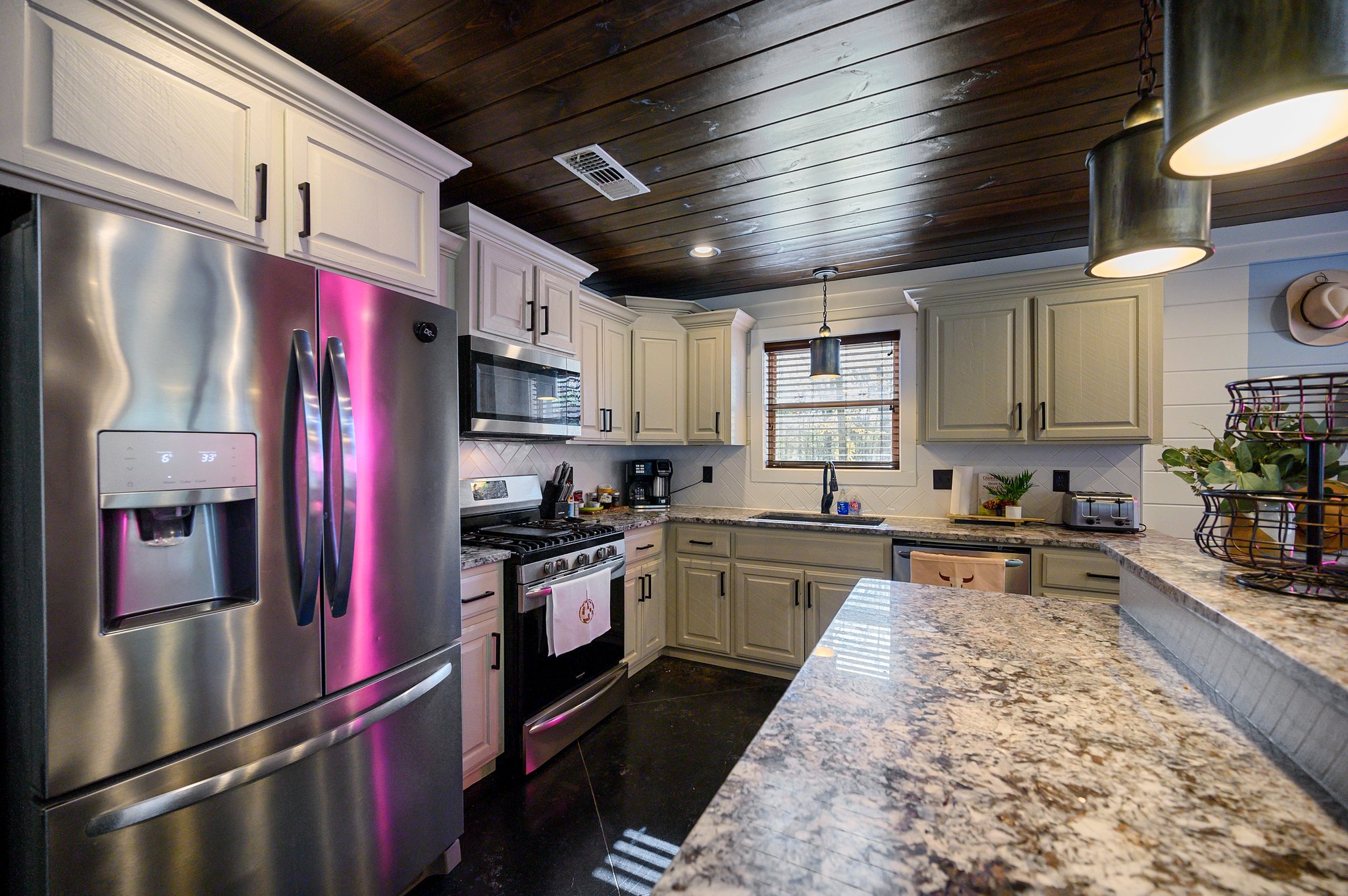 Store groceries and keep drinks cold in the spacious fridge with an ice and water dispenser.