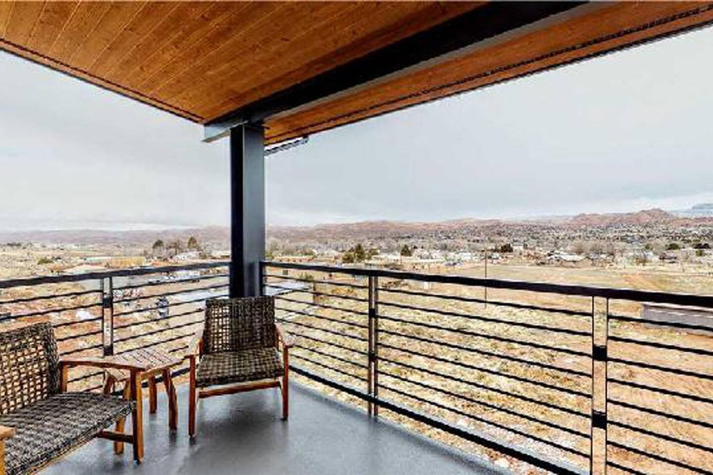 Covered private balcony on master suite with seating for 2 