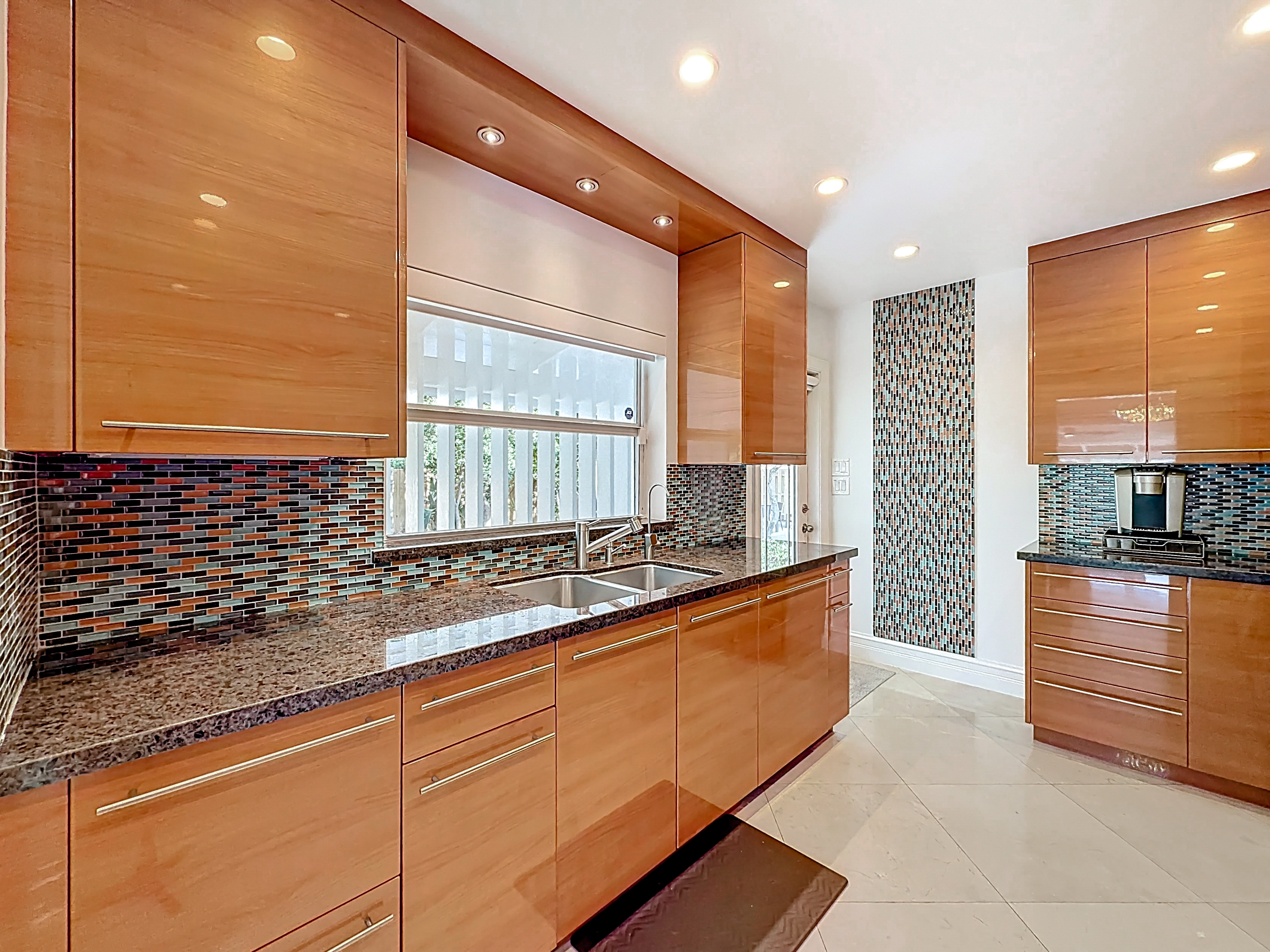 Door to the side yard, grill, and garage/laundry. It is nice being able to go in and out directly from the kitchen. 
