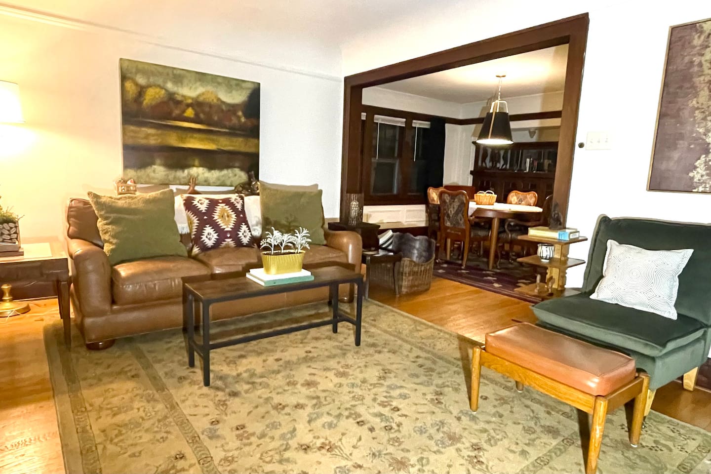 Thoughtfully styled Craftsman living room with original woodwork, leather seating, and timeless details that blend comfort with character.