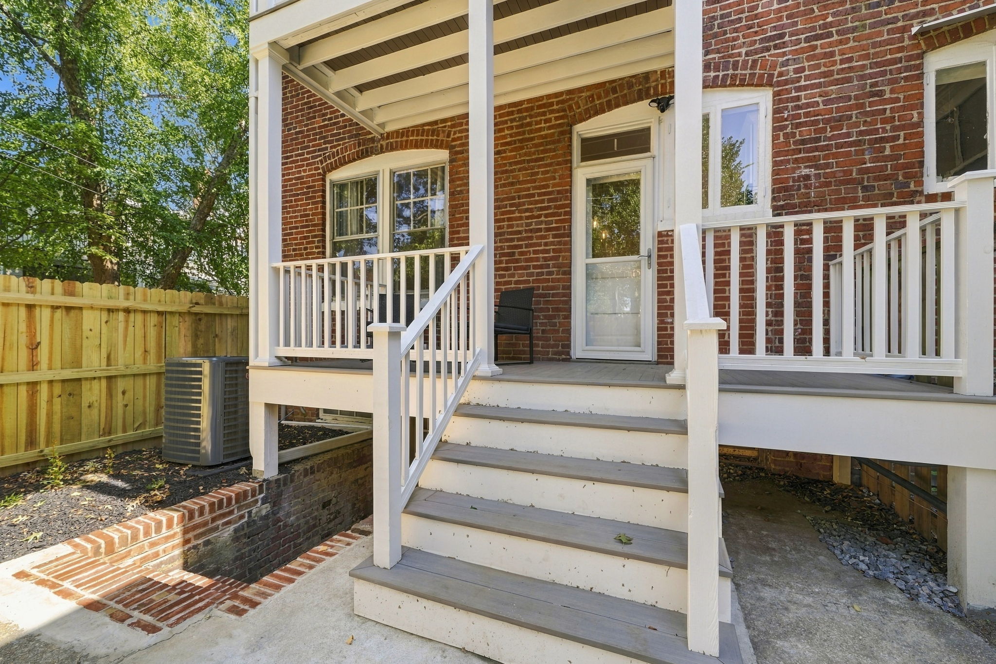 Patio Retreat: Enjoy your mornings on the charming patio surrounded by vibrant greenery!