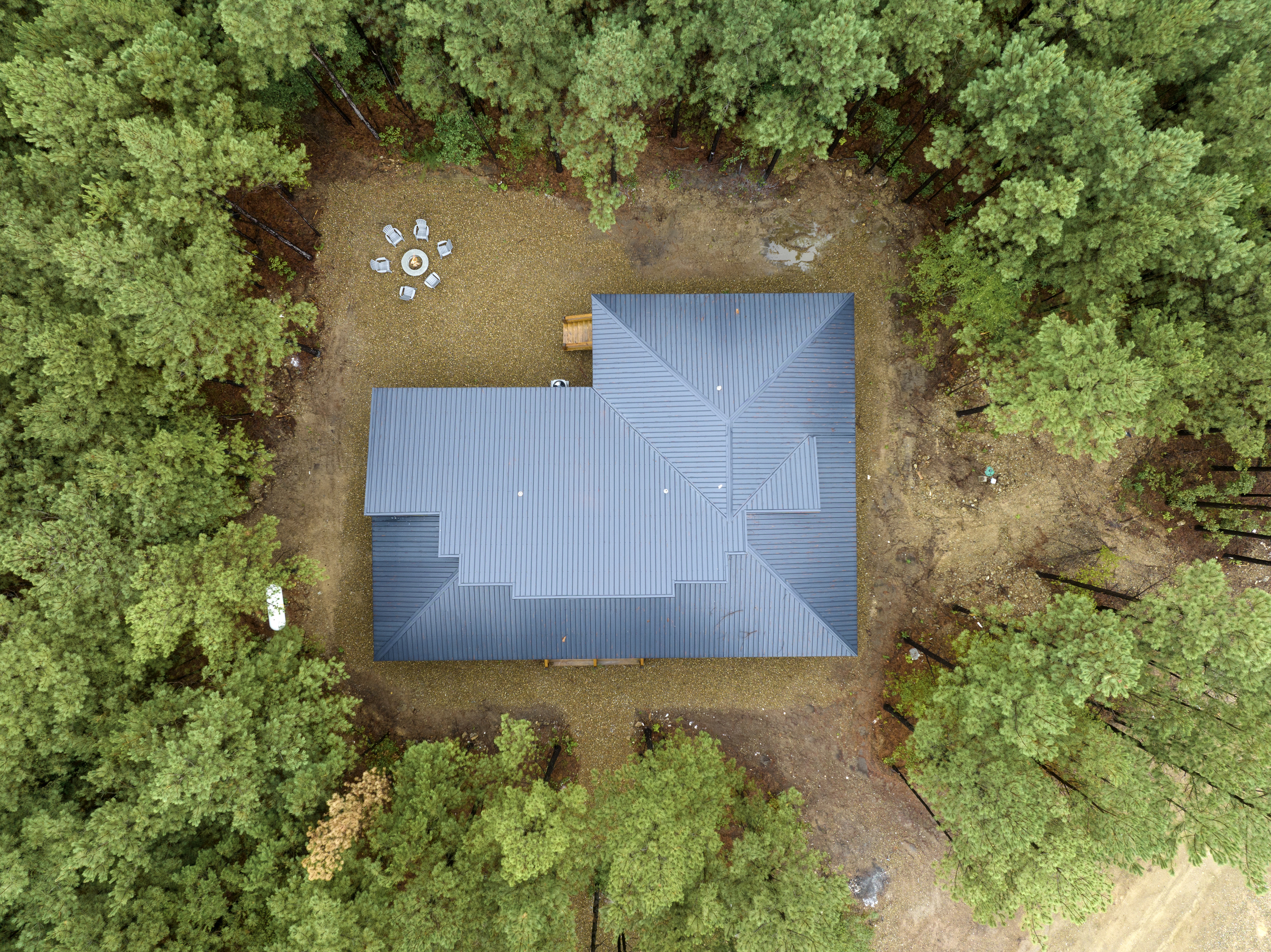 Nestled under beautiful tall pines. 