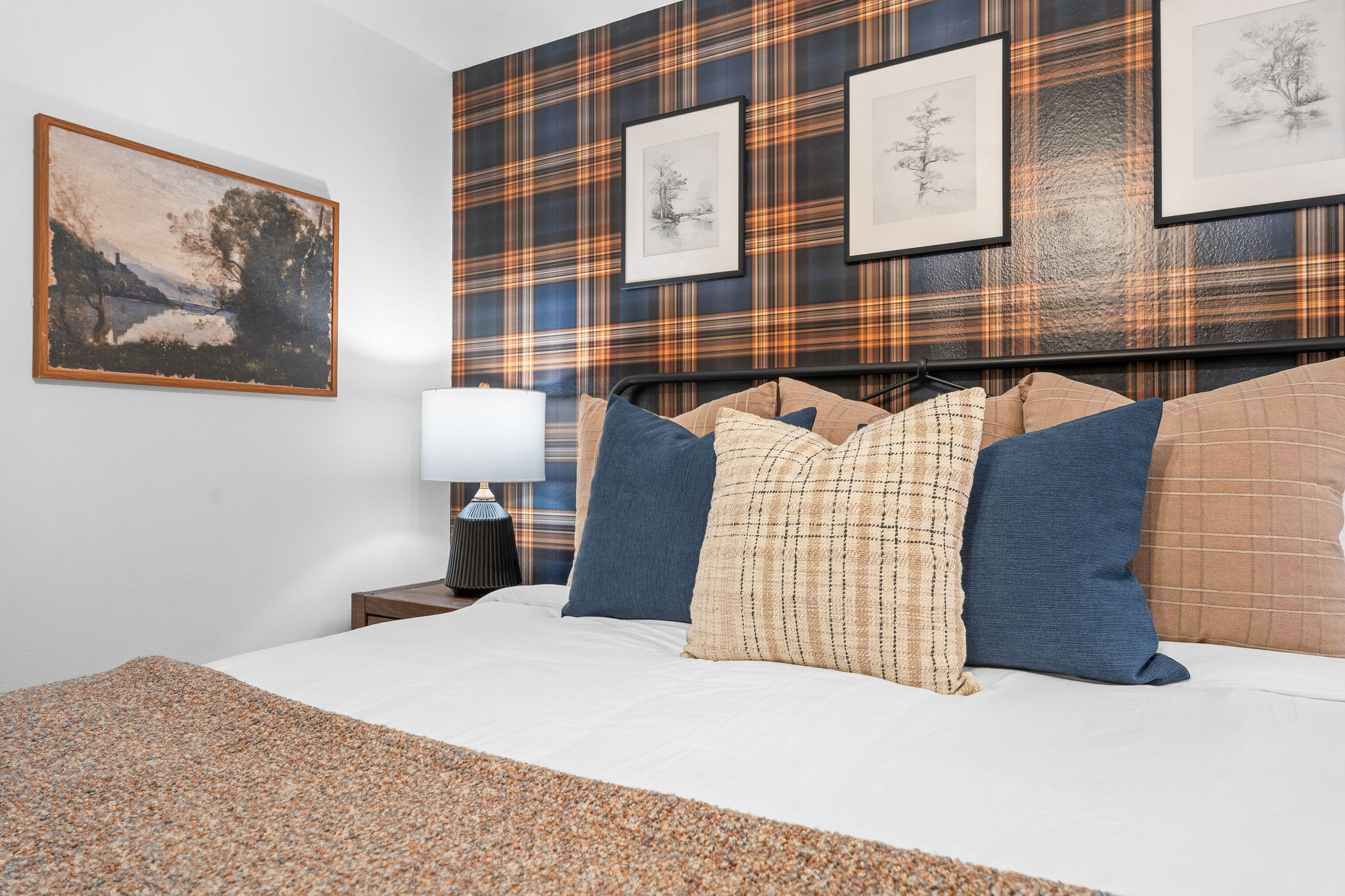 Comfortable bed with soft linens and warm, calming tones.