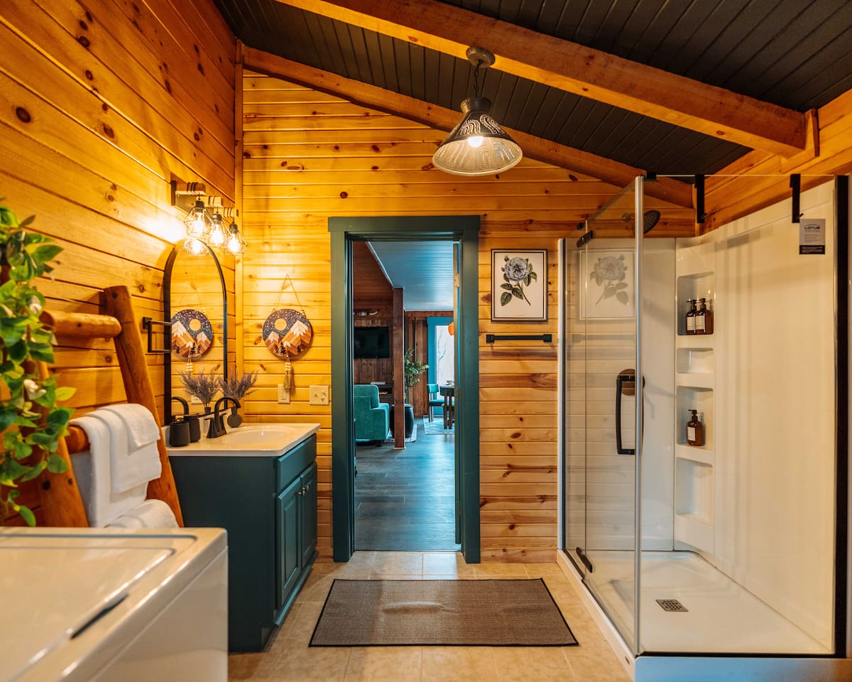 A modern botanical refresh, complete with a glass-enclosed standing shower